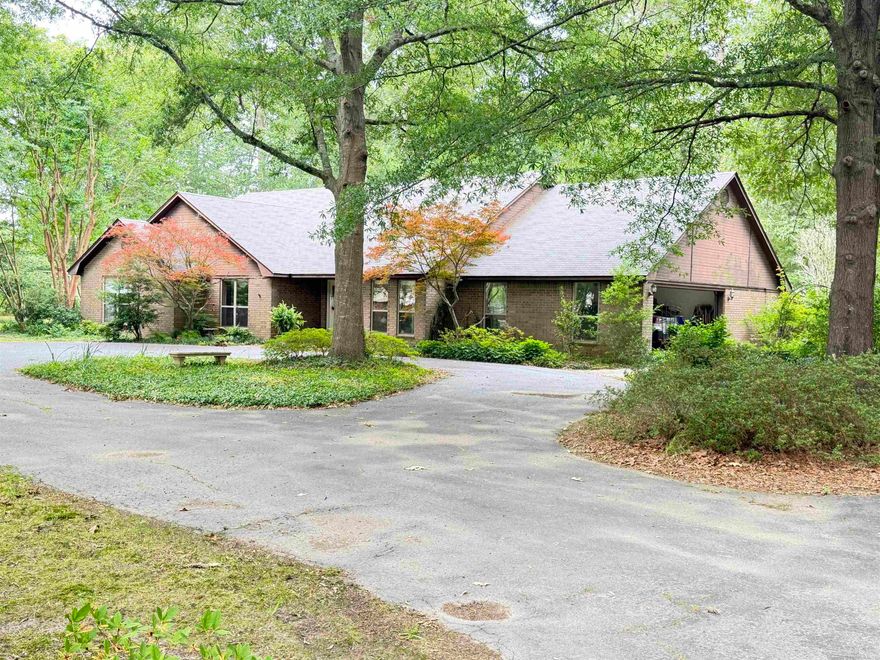 This charming three-bedroom, two-and-a-half-bath brick home offers the perfect blend of comfort, space, and privacy. Each bedroom is generously sized with ample closet space, while the large bathrooms provide plenty of room to relax and unwind. A convenient half bath adds extra functionality for guests. The kitchen is thoughtfully designed with efficiency in mind, featuring a pantry for added storage and easy organization. Just off the kitchen, a separate dining room creates the ideal setting for family meals or entertaining. The spacious living room serves as the heart of the home, complete with a cozy wood-burning stove that adds warmth and character. A beautiful entryway welcomes you in, setting the tone for the rest of the home. Additional features include a separate laundry room and a large walk-in storage area, ensuring everything has its place. Situated on ten  wooded, secluded acres, this property offers peace and privacy while still providing practical outdoor amenities. The 150x150 fenced backyard is perfect for pets, gardening, or outdoor gatherings, and a 20x30 shop provides excellent space for hobbies, equipment, or workspace needs. This is an ideal place to call home