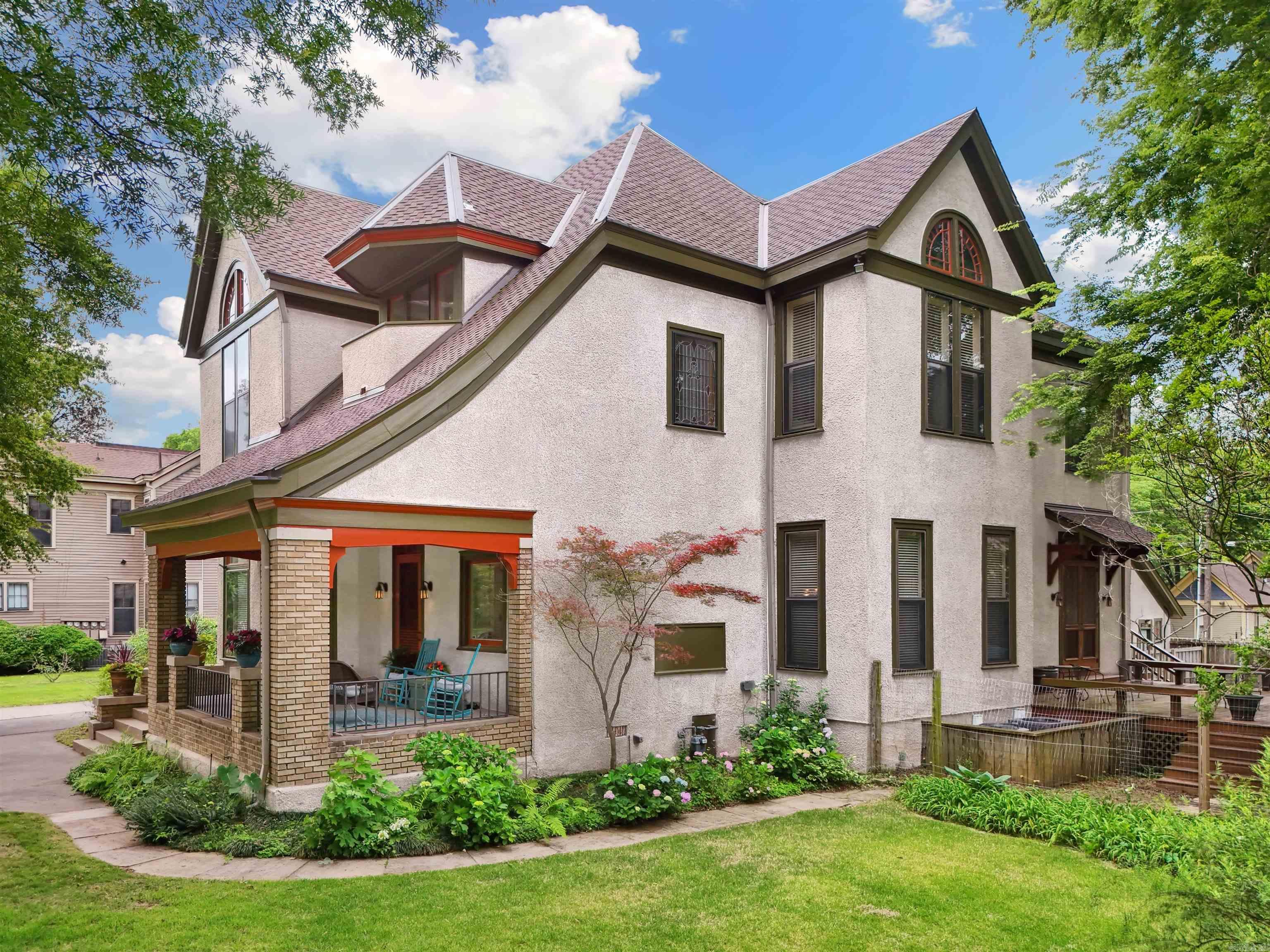 This historic charmer boasts an array of unique features and amenities that blend timeless charm with modern convenience. Features include 12' ceilings, fresh exterior paint, a grand foyer, front and back parlors, sunroom, parquet wood flooring, antique downstairs lighting, transom windows, and Spanish Cedar wood doors. The kitchen is a chef's dream with a Lacanche dual range oven, butler's pantry, and marble and stainless steel counters. Exterior features include a carriage house that is a 1 / 3 apartment with the rest storage that can easily be converted into a garage, in-ground sprinklers, and landscaping. This Quapaw Quarter home is located near Pettaway Square and the SoMa District, offering easy access to downtown dining, shopping, museums, parks, and The River Market. Family and pet-friendly is a great way to describe this tight-knit neighborhood. This property is not just a house; it's a lifestyle, offering everything one might desire for sophisticated urban living, with a quaint, historical charm. See attached videos for 3D tour and aerial drone footage. See attached documents for the fascinating history of home.