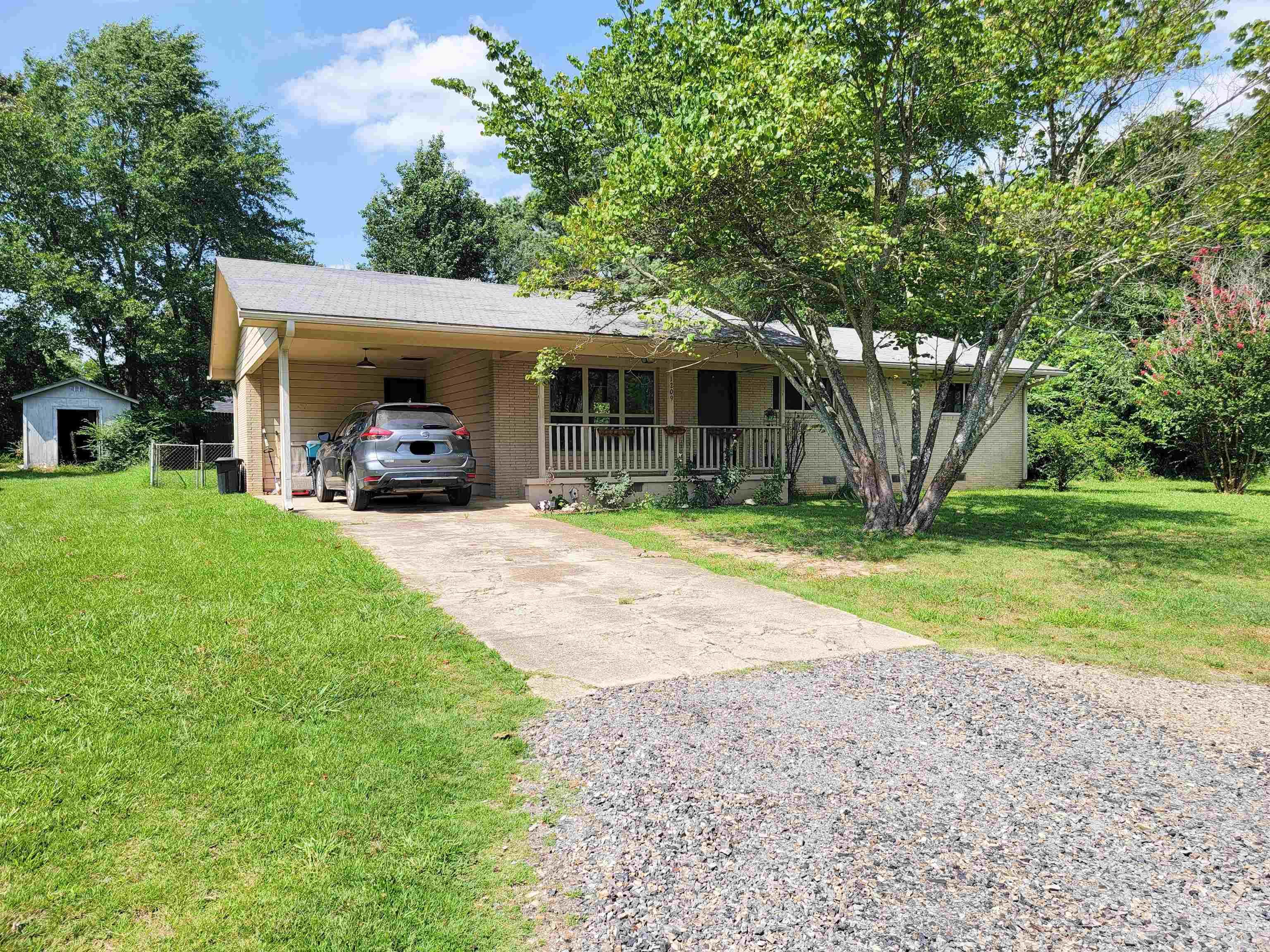 Tucked away at the end of the street, this charming brick home sits on 0.26 acre lot within city limits. Inside, natural light fills the inviting living spaces, creating a bright & welcoming atmosphere. The open floor plan seamlessly connects the living room to the dining area, perfect for everyday living. Updated fans, fixtures, plugs & switches. Both water heaters 2 yrs old, one electric & one gas. HVAC is 4 years old. Newer vinyl flooring throughout home. New class 4 shingle roof installed 6/2024. Large fenced backyard with patio & shade trees, ideal for relaxing & entertaining.