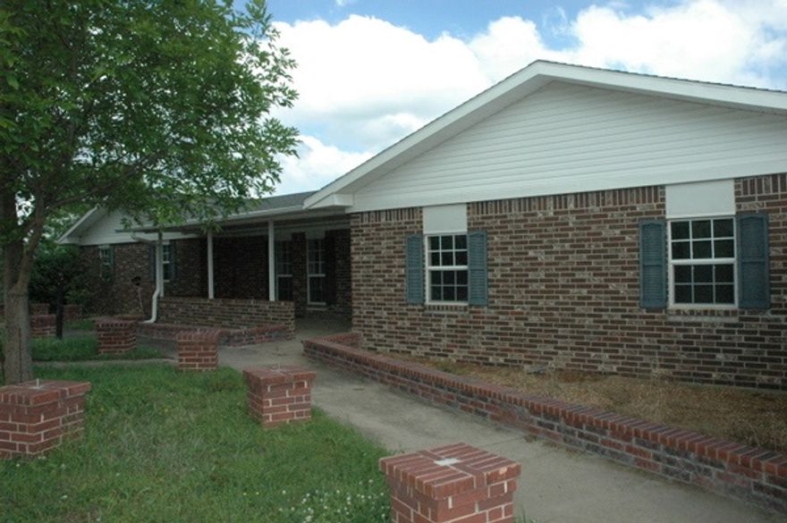 Beautiful setting just off Hwy 336.  Property has lots of fencing for livestock or crops, barn, garage along with a Large Pond with several wooden docks extending out into the pond.  Large house with a couple of additions on it.  This is a bank foreclosed property and the house needs major work and updating. Property also has utility set ups for travel trailers or mobile homes. 5 mobiles on property are mostly unusable. Nice area for deer and turkey. As-Is Sale. Minerals Do Not Convey.