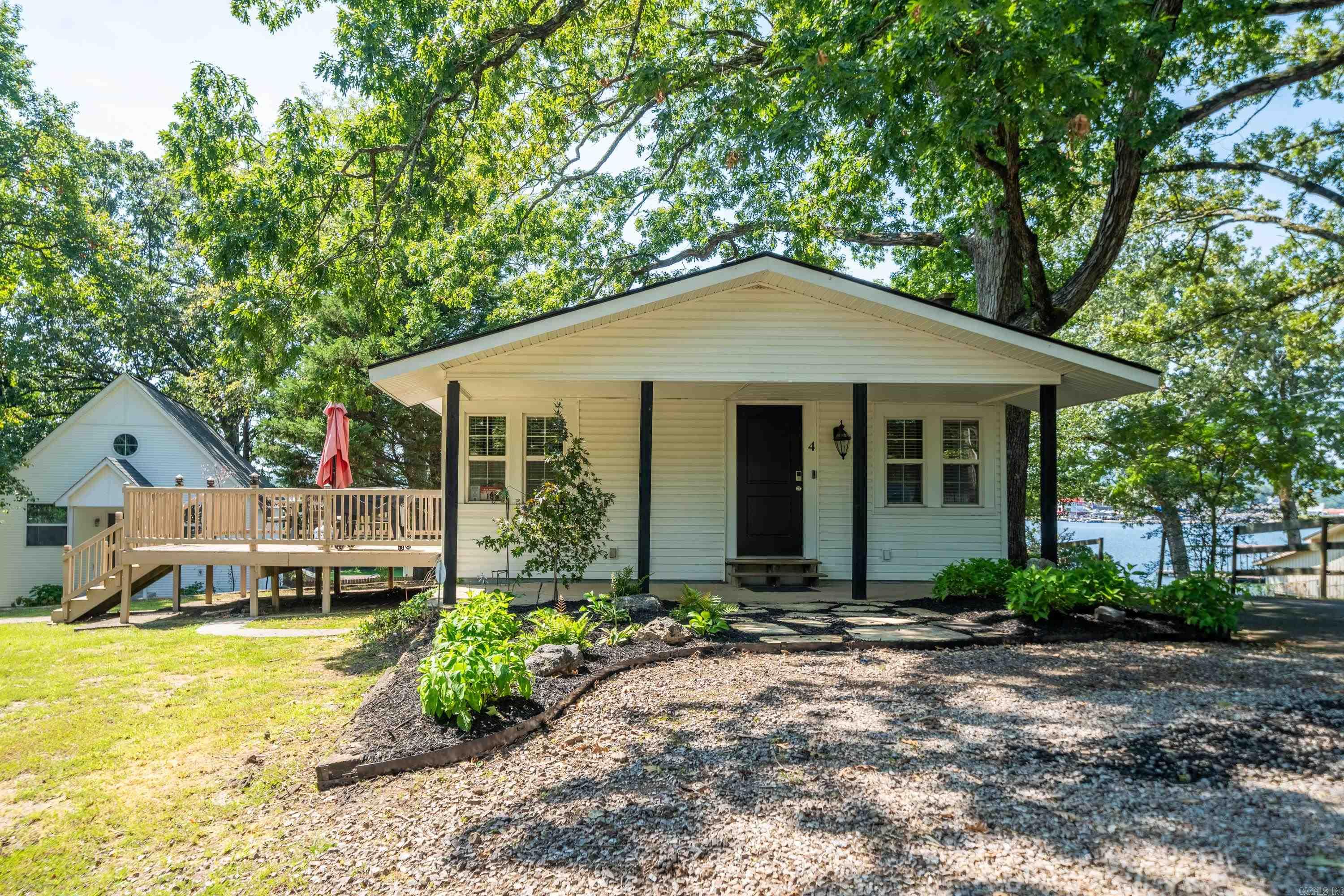 Investors take notice! Very active Short Term Rental with a permit. Welcome to your charming lakeside retreat! This remodeled 1 bed 1 bath cottage offers a cozy and inviting living space with modern updates throughout. Enjoy the convenience of lake access, complete with POA boat slips and boardwalks for easy boating and waterfront activities. Located in a central area, you'll have quick access to nearby amenities and attractions. Whether you're looking for a peaceful weekend getaway or a year-round home, this cottage provides the perfect blend of comfort and convenience. Don't miss out on this opportunity. P&L in associated docs. No sellers property disclosure offered. New roof 2024. Remodel 2023. Sold fully furnished.