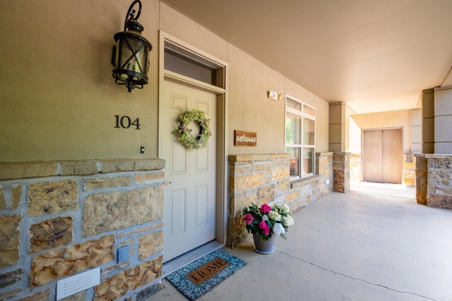 The premier unit of Vallon on the main floor with windows on the front back and side that allow plenty of natural light! Site finished hardwood floors throughout the home along with carpet in the bedrooms and tile in the baths. The living, dining and kitchen are very large and open to each other. The living room has a gas logs fireplace and doors that lead out to the covered patio. The kitchen has lots of cabinet space along with stainless steel appliances and granite countertops with a breakfast bar. Both bedrooms are very good sizes with the primary having lots of windows. The primary bath has a separate tub and shower, two vanities and a large walk in closet. 9 Foot ceiling throughout. The patio looks onto grounds that contain a walking path, putting green and pool area with a hot tub and two cabanas - one having a fireplace and the other a kitchen area. A lovely garden is also located on the premises.