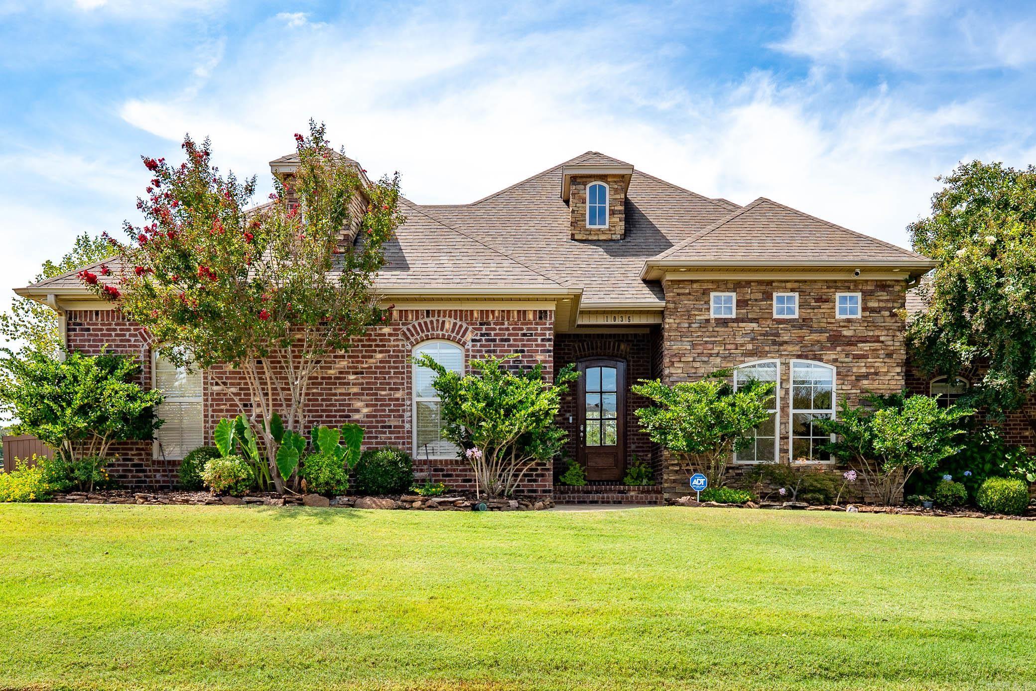 Beautiful, well-maintained 3-bedroom, 2-bath home on a spacious corner lot in Chestnut Meadows subdivision. The welcoming foyer opens into a large living room centered around a stunning stone fireplace and great natural light. The open-concept layout flows into the kitchen with new granite countertops, abundant cabinetry, stainless steel appliances, and generous island with bar seating, and an adjoining dining space. The primary suite offers a spacious bedroom, great bathroom featuring double vanities, a tub/shower combo with custom tile surround, walk-in closet, and adjacent laundry room. Two additional bedrooms are nicely sized and share a beautifully updated hall bath with new cabinetry and granite countertops. Outside there is a large patio with a covered area and large open area perfect for entertaining. The yard is fully fenced with a wood privacy fence, ample yard/green space enhanced by extra landscaping and sprinkler system. Additional features include a side-entry two-car garage and plenty of curb appeal from the corner lot.