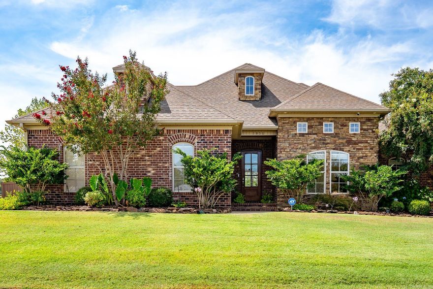 Beautiful, well-maintained 3-bedroom, 2-bath home on a spacious corner lot in Chestnut Meadows subdivision. The welcoming foyer opens into a large living room centered around a stunning stone fireplace and great natural light. The open-concept layout flows into the kitchen with new granite countertops, abundant cabinetry, stainless steel appliances, and generous island with bar seating, and an adjoining dining space. The primary suite offers a spacious bedroom, great bathroom featuring double vanities, a tub/shower combo with custom tile surround, walk-in closet, and adjacent laundry room. Two additional bedrooms are nicely sized and share a beautifully updated hall bath with new cabinetry and granite countertops. Outside there is a large patio with a covered area and large open area perfect for entertaining. The yard is fully fenced with a wood privacy fence, ample yard/green space enhanced by extra landscaping and sprinkler system. Additional features include a side-entry two-car garage and plenty of curb appeal from the corner lot.