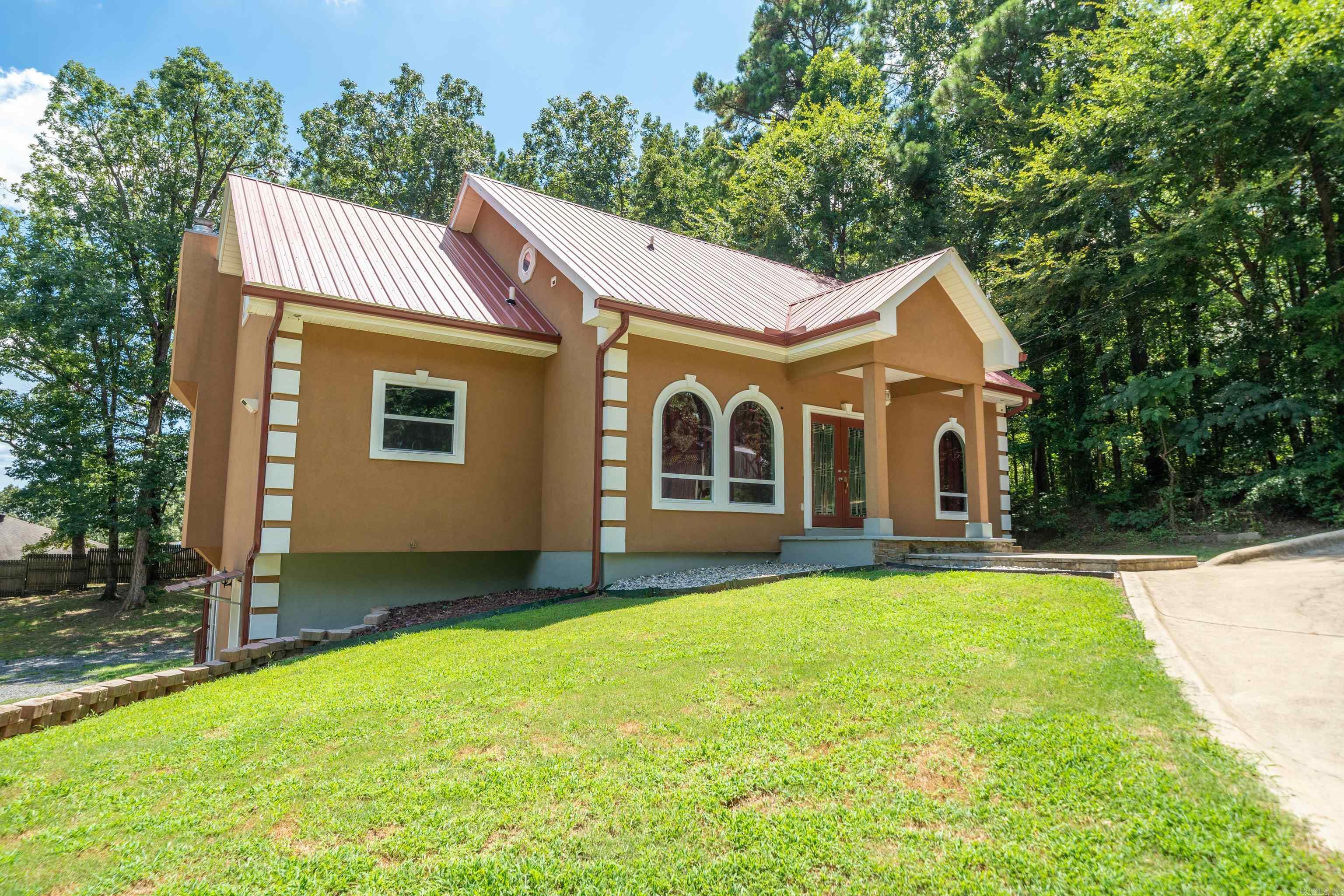 Discover this completely remodeled home offering the perfect solution for multi-generational living or savvy investors seeking dual income potential. This impressive 5-bedroom, 4-bathroom home spans 3,615 square feet and cleverly features two separate living spaces that could make even the most territorial in-laws smile with appreciation. The downstairs living area comes equipped with its own full kitchen, creating an ideal setup for two families to coexist harmoniously without disputes over refrigerator real estate. Whether you're housing college kids, aging parents, or running a rental operation, this flexible floor plan adapts to your lifestyle needs. Fresh renovations including crown molding throughout ensure modern comfort and style, while the generous square footage provides ample room for everyone to spread out. The thoughtful design maximizes both privacy and togetherness, making family gatherings enjoyable rather than overwhelming. This property represents a rare opportunity to own a versatile home that truly works as hard as you do.