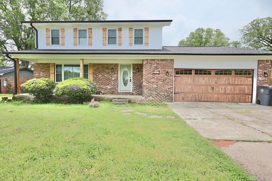 This two-story Hot Springs home boasts four bedrooms and two bathrooms on the top level, plus a half-bath on the lower level. Located in Lakeside School District, it features a kitchen with a gas cooktop stove and electric oven, spacious living area, sunken den, and a cozy breakfast area. Other key features include central heat and air, a fireplace with gas wood, insulated garage, and gutters. Outside, a fully-fenced backyard offers ample privacy for your own personal retreat. Don't miss out on a great house at an affordable price!