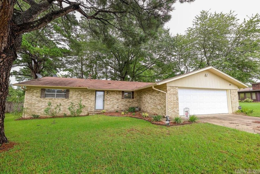 This cozy home has 3 bedrooms and 2 baths, and offers a layout that balances style and function.  The heart of the home opens up to a generous living area with a wood burning fireplace, as well as an open concept kitchen and dining, ideal for both everyday living and entertaining guests. The outdoor space is a true highlight with a large deck, overlooking a spacious fenced in backyard.  Perfect for family gatherings, pets, or simply enjoying a peaceful moment outside.  Nestled in a sought-after neighborhood within walking distance of the SAU Farm Road and the beautiful SAU campus.  You are sure to enjoy the convenience of nearby shopping, dining and schools. Square footage and lot size per county tax record.