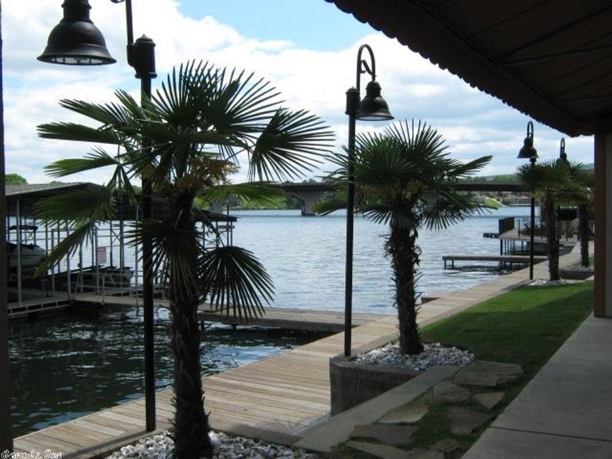 Stunning Lake Condominium at Fiesta Bay.  Walk In Level and Furnished to the 9's. Breathtaking Views from Most Rooms and Fabulous Outside Veranda!  The Pool Area is Wonderful With Outdoor Kitchen Facilities and Fire Pit.  Plus Extensive Boardwalk Along Lake Frontage and Great Swim Dock or For Temporary Docking!  No Boat Slip, but Several Marinas Within a Block For No Hassle!  Let Them Do All the Work and You Just Drive Up to Your Front Door and Start Enjoying!  Interior Finishes and Floor Plan Are the BEST!