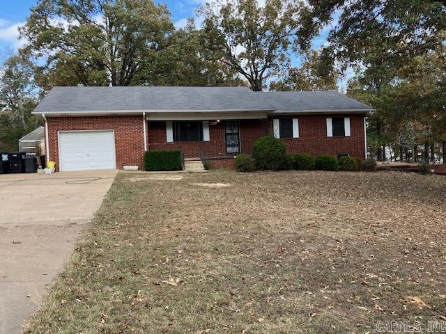 Brick home on 2 acres! This is a solid, well built brick home on 2 acres with all city utilities. The main level features 3br/2ba and contains approximately 1584 square feet of space. It has a large living room and dining room. Down the hallway, you will find the main bathroom and across from it, two bedrooms. At the end, you will find the master suite.  The kitchen has plenty of cabinets and the oven and fridge do convey.   In the walkout basement, you will find an additional 685 square feet of finished space that is currently being used as 2 additional bedrooms, complete with closets. Plus an additional 416 square feet  of unfinished utility space that is heated and cooled. The garage was being converted to a 6th bedroom and could easily be used as that with a little work or could be converted back to a full garage. In addition, there is 180 square feet of storage built into the back of the garage space.   With 2,685 square feet heated and cooled and located on 2 mostly flat acres, the possibilities are many with this one.