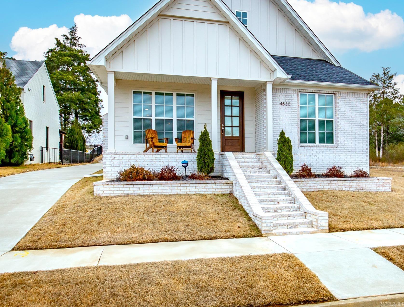You'll fall in love with this better-than-new home, nestled in a peaceful and secluded neighborhood while remaining conveniently close to local amenities! This stunning property offers 4 bedrooms and 3.5 bathrooms, combining modern style with thoughtful functionality. Start your day on the charming front porch, perfect for enjoying your morning coffee. Inside, you'll find elegant quartz countertops throughout, gorgeous wood flooring, and a cozy gas fireplace that creates a warm and inviting living space. The luxurious primary suite boasts an oversized walk-in closet and a spa-like soaker tub, offering the perfect retreat at the end of the day. Practicality meets style with a well-appointed laundry room featuring ample cabinet storage, while the rear-loading 2-car garage provides both convenience and curb appeal. A tankless water heater ensures energy efficiency for modern living. This home beautifully blends contemporary amenities with a serene setting. Don’t miss this incredible opportunity—schedule your showing today!
