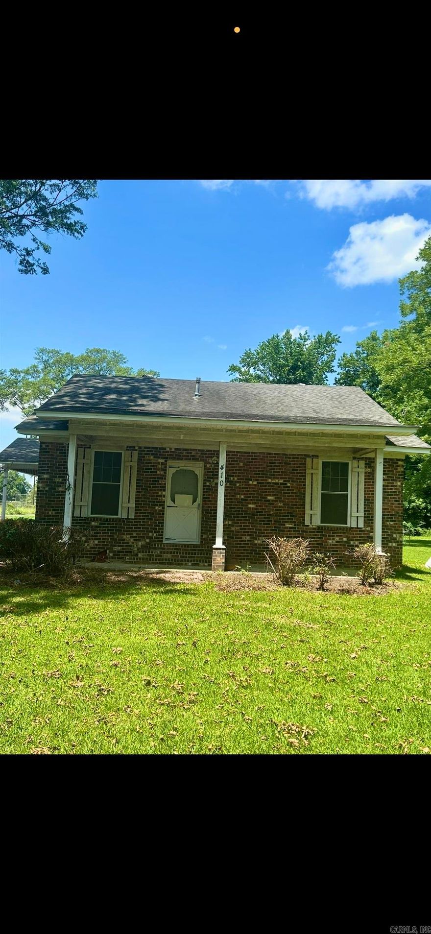 Welcome to 410 S Trotter Street in Dermott, Arkansas, where timeless character meets everyday functionality.  Situated on a spacious corner lot, this 3-bedroom, 2-bath home offers approximately 1,793 square feet of living space filled with distinctive architectural details and practical features. Inside, you’ll find original hardwood floors, tall ceilings, French doors, decorative trim, and unique spaces that reflect the homes charm and history.  The spacious kitchen provides ample cabinet and countertop space, while multiple living and gathering areas offer flexibility for everyday living. A detached storage building provides additional room for tools, hobbies, or seasonal storage.  One of the property’s most valuable features is the Generac whole-home generator, offering added peace of mind and backup power when needed. Additional exterior features include gutters, a covered carport, and a corner lot location.  If you’ve been searching for a home with character, space, and practical amenities, 410 S Trotter Street offers a unique opportunity to make it your own.