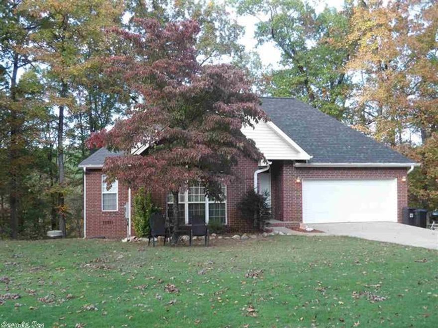 This home has the feel of country living, but is only a 30 minute trip to Little Rock or 20 minutes to Hot Springs. Lovely manicured lawn that buts up to wooded areas on 3 sides for tons of privacy. The interior features beautiful columns that make a grand statement at the entrance of the family room. The dining room features beautiful views of the mountains. Master bath features dual vanities and two glass block windows for lots of natural lighting. Good size bedrooms w/ lots of storage.
