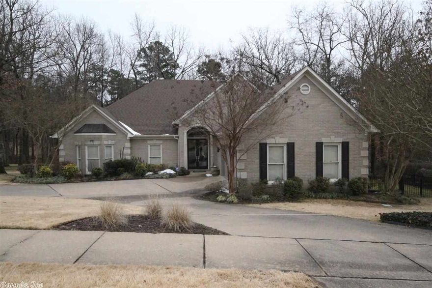 This home has been totally remodeled with beautiful hardwood floors, stained concrete, large kitchen with Granite tops. Beautiful Master Bath.  Stainless steel Kitchen Aid appliances,  Surround sound speakers.  Private Veranda in the back overlooking small creek and green space. Circle drive into home.  Rod iron fenced side yard.