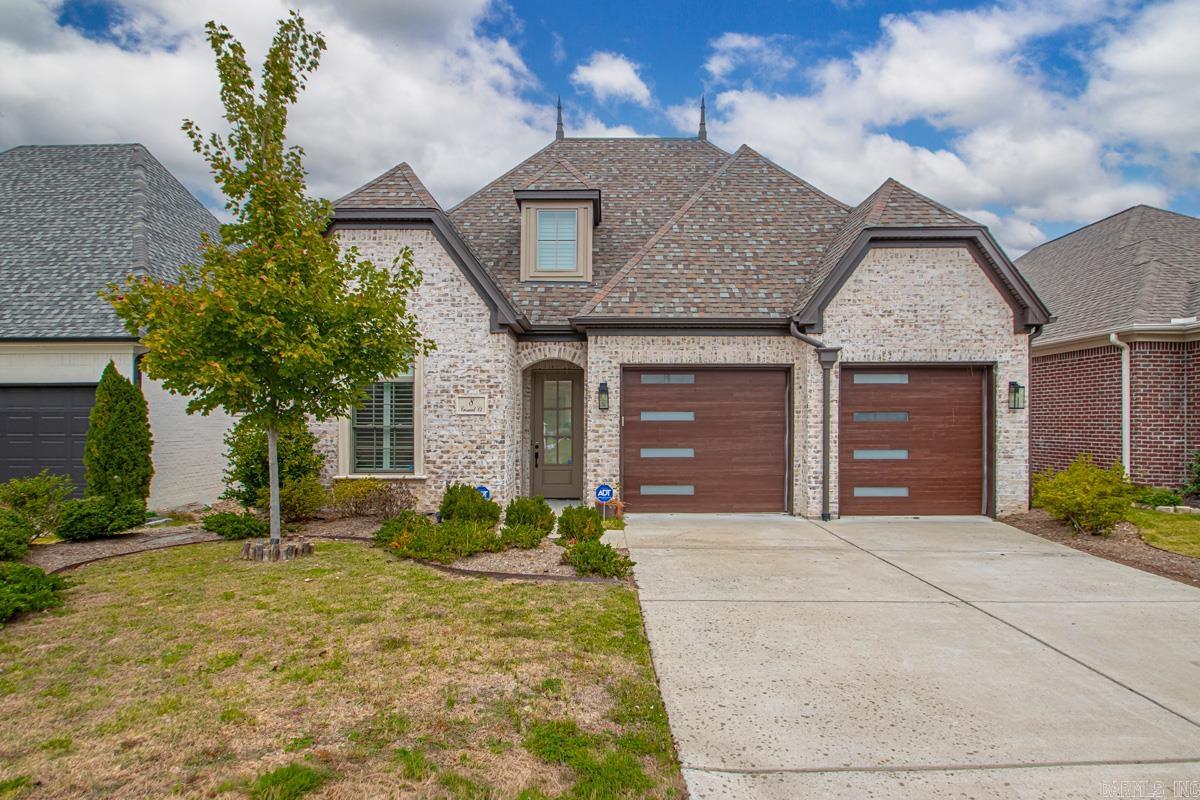 Welcome home to 8 Crosswood Court in beautiful Wildwood Place ā where modern design meets everyday comfort. Step inside and be greeted by 11-foot ceilings, open floor plan, soft natural light, and an electric LED fireplace that instantly makes the space feel like home. The kitchen is a chefās dream, featuring a large island, gas stove with an instant hot-water pot filler, wet bar with wine frig and also a separate wine room, and stylish finishes made for entertaining. The fourth bedroom offers endless versatility ā perfect as a bonus room, home office, or media room. Throughout the home, youāll find thoughtful touches like custom plantation shutters, lights on the stairs, custom gutters, pre-wired surround sound, and outdoor landscape lighting that enhances every evening. Every detail has been designed for balance, beauty, function, and comfort ā making this home the perfect place to create your next chapter.