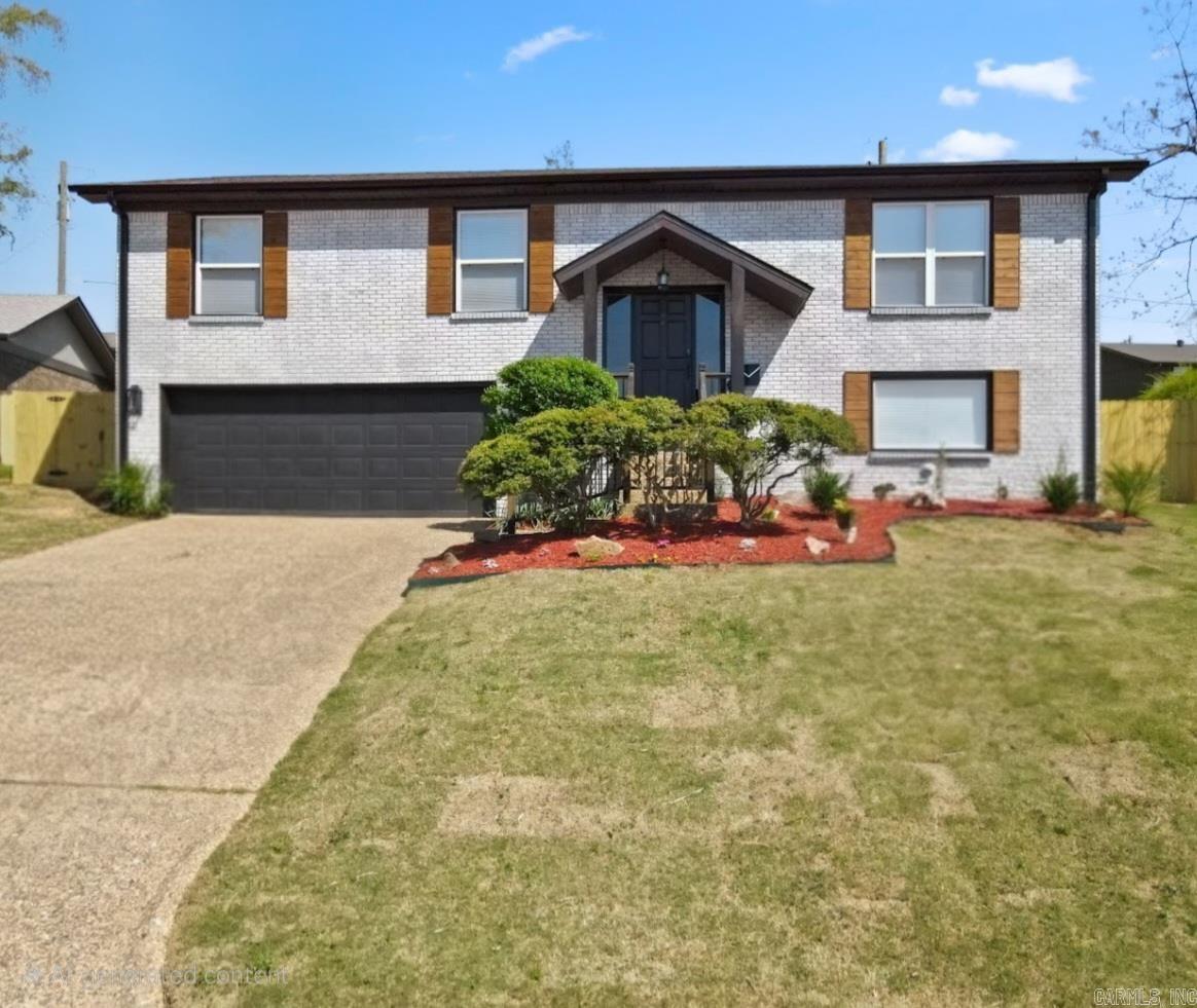 This stunning like-new 4-bed, 3-bath split-level home has been completely remodeled from the studs up! Featuring two luxurious primary suites, this home offers modern convenience and high-end finishes throughout. Enjoy dual HVAC systems for optimal comfort and Cat6 Ethernet wiring for lightning-fast internet. The 240V garage plug is perfect for EV owners or hobbyists. The chef’s kitchen boasts a gas stove, granite countertops, and an open-concept design flowing into the main living space with an electric fireplace. The spa-like primary suite downstairs includes a show-stopping walk-in closet. Control your landscape lighting from anywhere with the WiFi-enabled app. The home also features an app-controlled smart water heater, LVP flooring in main areas, tile bathrooms, and a fully fenced yard. Conveniently located near shopping, restaurants, and easy interstate access, this modern masterpiece is ready for you to call home!