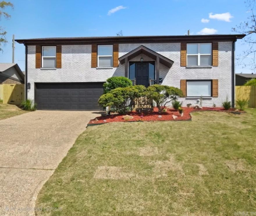 This stunning like-new 4-bed, 3-bath split-level home has been completely remodeled from the studs up! Featuring two luxurious primary suites, this home offers modern convenience and high-end finishes throughout.  Enjoy dual HVAC systems for optimal comfort and Cat6 Ethernet wiring for lightning-fast internet. The 240V garage plug is perfect for EV owners or hobbyists.  The chef’s kitchen boasts a gas stove, granite countertops, and an open-concept design flowing into the main living space with an electric fireplace. The spa-like  primary suite downstairs includes a show-stopping walk-in closet.  Control your landscape lighting from anywhere with the WiFi-enabled app. The home also features an app-controlled smart water heater, LVP flooring in main areas, tile bathrooms, and a fully fenced yard.  Conveniently located near shopping, restaurants, and easy interstate access, this modern masterpiece is ready for you to call home!