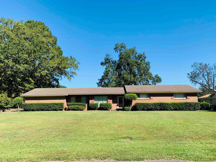 Space for a growing family in this 3BR/2BA brick home on a spacious nearly 1 acre lot. Over 2200 sq. ft. featuring an open concept kitchen/dining/den area complete with kitchen appliances. There is also a living room/dining room combo - perfect for holidays or family get togethers. All bedrooms are good sized with nice closet space. The primary bath has double vanities, new flooring, and unique sunken tub. Don't miss out on this great house!