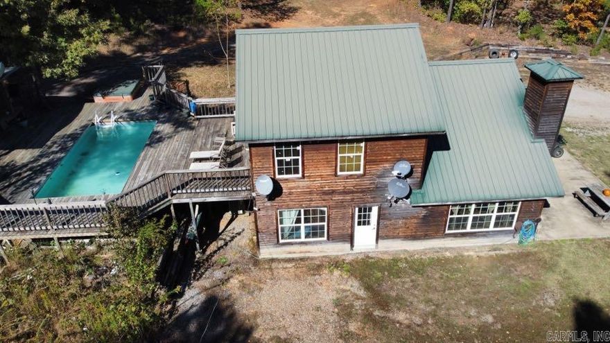 Discover your dream retreat in the heart of the countryside! This custom-built home is a sanctuary close to the national forest, surrounded by an extensive network of ATV trails, making it a haven for outdoor enthusiasts. The interior showcases the highest quality craftsmanship with custom oak cabinetry and stair rails, creating an inviting and warm ambiance. The split floor plan offers privacy, with a spacious master suite that's your personal oasis. Step outside onto the generous deck, where an above-ground pool and outdoor kitchen set the stage for memorable gatherings and entertaining by the water. This property is more than a home; it's a lifestyle, providing access to nature and the perfect backdrop for relaxation and adventure. Don't miss the chance to make this haven your own!