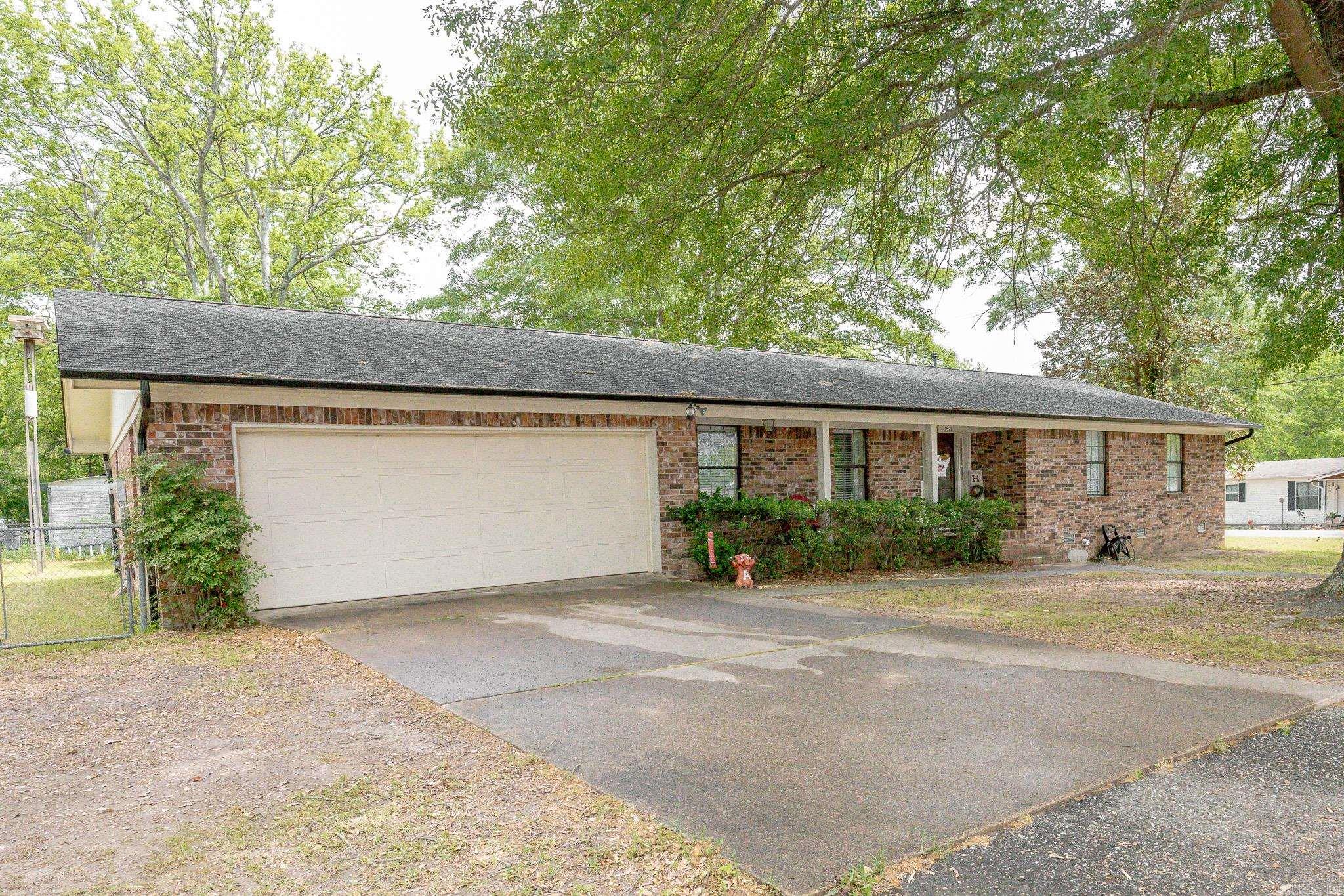 Spacious, solid, and full of charmāthis 3-bedroom, 3-bath brick beauty is ready to impress! Featuring a matching shop, two-car garage, and tons of storage throughout, this home was built with both comfort and function in mind. Step inside to find an inviting living space with a wood-burning fireplace, a large dining room just off the living area, and an eat-in kitchen with an additional dining nookāperfect for family gatherings or casual mornings. Each bedroom is generously sized, with the primary suite offering three closets, including a large walk-in closet thatās sure to impress. Recent updates make this home move-in ready: New garage door (April 2022) Attic insulation added (2023) New flooring (April 2024) New roof & matching gutters on home and shop (2023) Fresh paint, updated outlets, switches, vents, and ceiling fans (2022) New refrigerator ( 2024) New A/C & Heat (Feb 2025) Water Heater (2025) If youāve been looking for a home with space to stretch out, functional updates, and bonus shop spaceāall wrapped in classic brickāyouāll want to see this one in person!