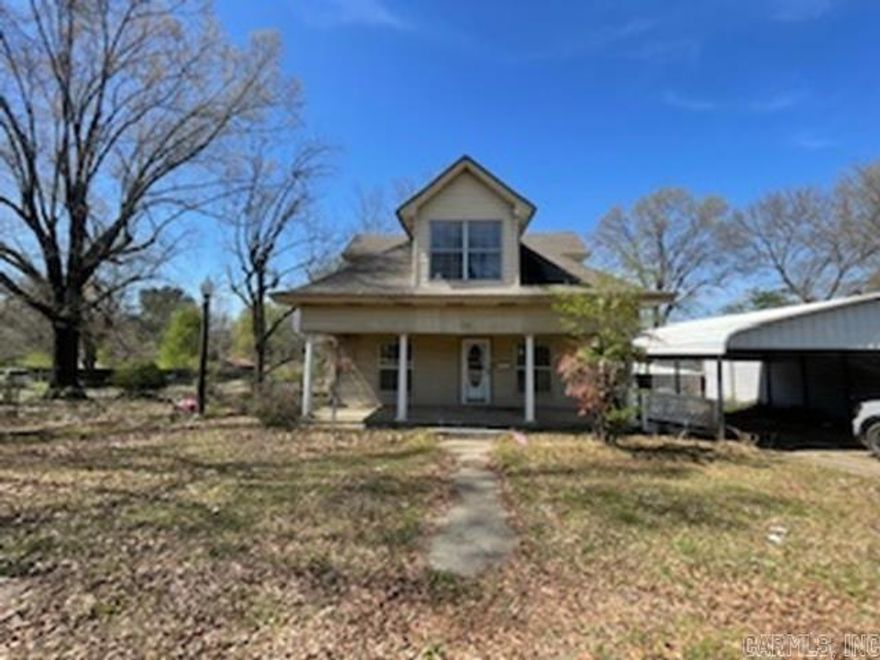 Great deal on the corner lot in the city limits of DeQueen! HUGE 1.41 acre lot, with 2 bedrooms on the main floor and a large 270sq ft dormer area upstairs with a full bath. Formal dining area, large kitchen, bonus room, laundry area, basement, sun room, covered porch and the land has a large gazebo! Fenced in backyard, garage and large carport! This property is a steal!  Agents see remarks!