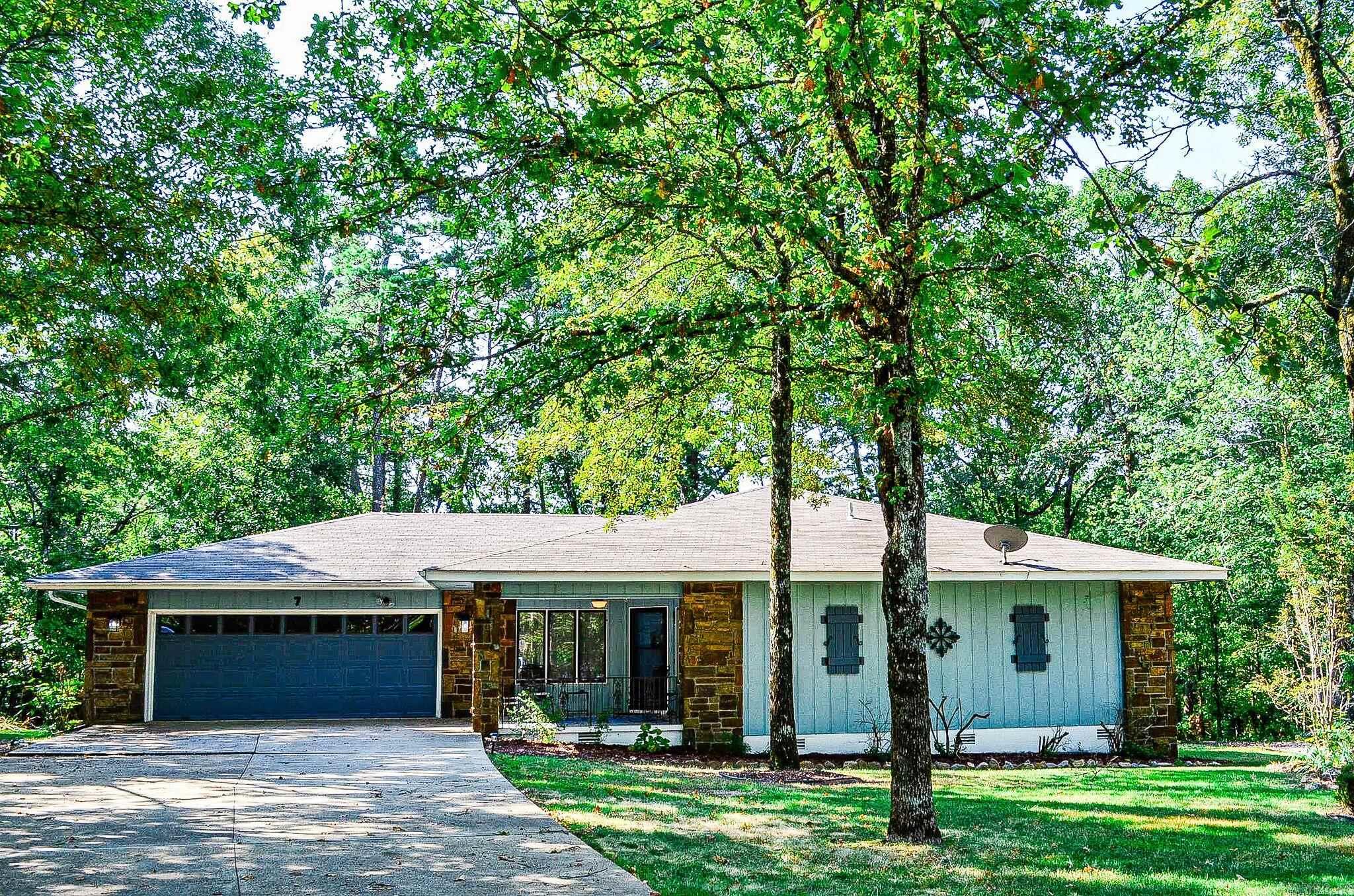 NEW ROOF ON THIS BEAUTIFUL 3 BEDROOM 2 BATH, MODIFIED "MADRID" FLOOR PLAN WITH A WOOD BURNING FIRE PLACE ON A FLAT WELL SHADED LOT AT THE END OF A CULDESAC. LARGE SUN ROOM OVERLOOKING A GORGEOUS, WELL SHADED BACKYARD AS WELL AS A LARGE FAIRLY NEW DECK ON THE BACK OF THE HOUSE. LARGE MASTER SUITE WITH 3 CLOSETS. THE KITCHEN OFFERS A NICE SIZE ISLAND WITH A NEW COOK TOP, NEW REFRIGERATOR, GARBAGE DISPOSAL AND LOTS OF STORAGE. LAUNDRY ROOM IS JUST OFF THE KITCHEN WITH NEW WASHER AND DRYER. LARGE GARAGE WITH A NICE WORK SHOP. BACK OF PROPERTY ADJOINS COMMON PROPERTY GIVING EXTRA PRIVACY. HOT SPRINGS VILLAGE P.O.A. HAS A ONE TIME BUY IN FEE OF $ 2,000.00 DUE AT CLOSING.