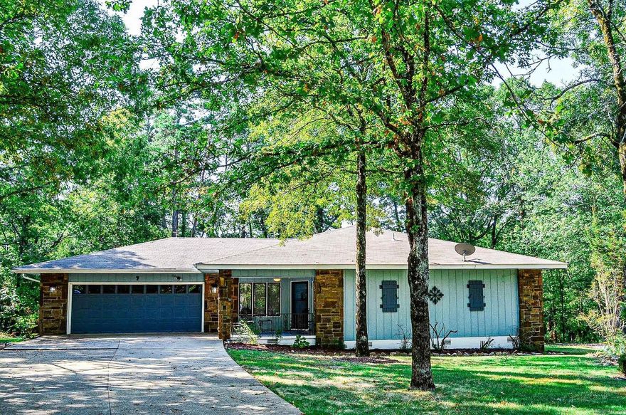 NEW ROOF ON THIS BEAUTIFUL 3 BEDROOM 2 BATH, MODIFIED "MADRID" FLOOR PLAN WITH A WOOD BURNING FIRE PLACE ON A FLAT WELL SHADED LOT AT THE END OF A CULDESAC. LARGE SUN ROOM OVERLOOKING A GORGEOUS, WELL SHADED BACKYARD AS WELL AS A LARGE FAIRLY NEW DECK ON THE BACK OF THE HOUSE. LARGE MASTER SUITE WITH 3 CLOSETS. THE KITCHEN OFFERS A NICE SIZE ISLAND WITH A NEW COOK TOP, NEW REFRIGERATOR, GARBAGE DISPOSAL AND LOTS OF STORAGE. LAUNDRY ROOM IS JUST OFF THE KITCHEN WITH NEW WASHER AND DRYER. LARGE GARAGE WITH A NICE WORK SHOP. BACK OF PROPERTY ADJOINS COMMON PROPERTY GIVING EXTRA PRIVACY. HOT SPRINGS VILLAGE P.O.A. HAS A ONE TIME BUY IN FEE OF $ 2,000.00 DUE AT CLOSING.