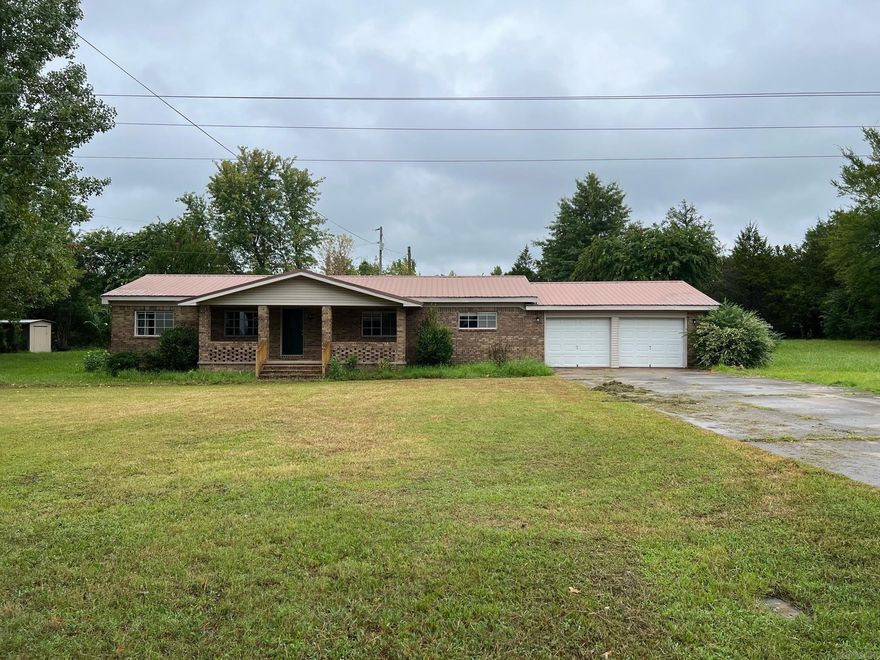 This is a manufactured home that has been bricked and 2 car garage added onto 3 bedroom 2 bath with metal roof.  Home is in decent shape.  Will need a stove and dishwasher. Other than that I think it will pass all inspections for a loan. Title is being held at the bank who is financing it.