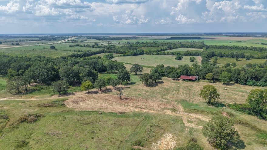 This 167-acre property in Miller County offers a combination of recreational, agricultural, and residential opportunities. Situated on one of the last available river bluff locations overlooking the Red River bottoms, the property provides scenic views and multiple land-use options. The tract includes two residential lots within the Sugar Hill subdivision, creating opportunities for building a home with utilities accessible nearby. A creek flows through the property, adding water resources and supporting local wildlife. The land features a mix of terrain suitable for outdoor recreation and hunting, with populations of deer and small game present in the area. Portions of the acreage could also be developed for cattle grazing or other agricultural use, offering flexibility for land management. With its creek, subdivision lots, and elevated position above the river bottoms, this tract brings together hunting, livestock potential, and residential building options in one location. The property maintains rural character while being within reach of town services and amenities.