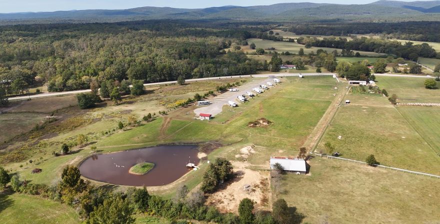 Income generating RV park & fully operational homestead farm! Sitting on 17 acres, this unique property is brimming with value and opportunity!   The RV park features 27 spots each with their full hook ups! The park has restrooms, showers and laundry facilities and is situated amongst the rolling hills and pastures of the Ouachita Mountains.  The Homestead property is next door and includes a spacious 4bed/2.5bath brick home with a fireplace!  There are several out buildings including a LARGE BARN, an insulated chicken & rooster coop, a shop, a Milking parlor w/ industrial equipment, and a brand new GREEN HOUSE! There is an orchard with various fruit trees and a large established garden! There are several fenced grazing areas for livestock, and a 1.5 acre pond!!  Situated just 15 mins from Mena, an hour from Mt. Ida, minutes from ATV trails, the Ouachita River and incredible national forest, This is a rare opportunity to create true independence with a successful Turn-Key RV business, and an established homestead farm!