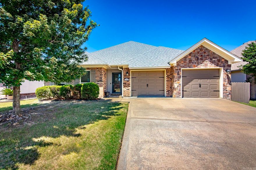 Step into comfort and style with this beautifully updated single-story home offering just under 1,800 square feet of thoughtfully designed living space. Featuring 3 spacious bedrooms and 2 full bathrooms, this home combines modern updates with warm, inviting character throughout.  The open-concept floor plan creates the perfect space for everyday living and entertaining, seamlessly connecting the dining area, living room, and kitchen. The kitchen is a standout with granite countertops, a large island, and plenty of prep and gathering space, while the living area showcases stunning vaulted ceilings accented with custom wood beams that add charm and architectural detail.  Recent updates include fresh interior paint, newer carpet, a newly installed fence, and a professionally repainted and sealed exterior, giving this home a fresh, move-in ready feel from top to bottom.  Outside, enjoy a fully fenced backyard that backs up to peaceful green space, creating added privacy and a relaxing setting for morning coffee, weekend gatherings, or quiet evenings under the stars.
