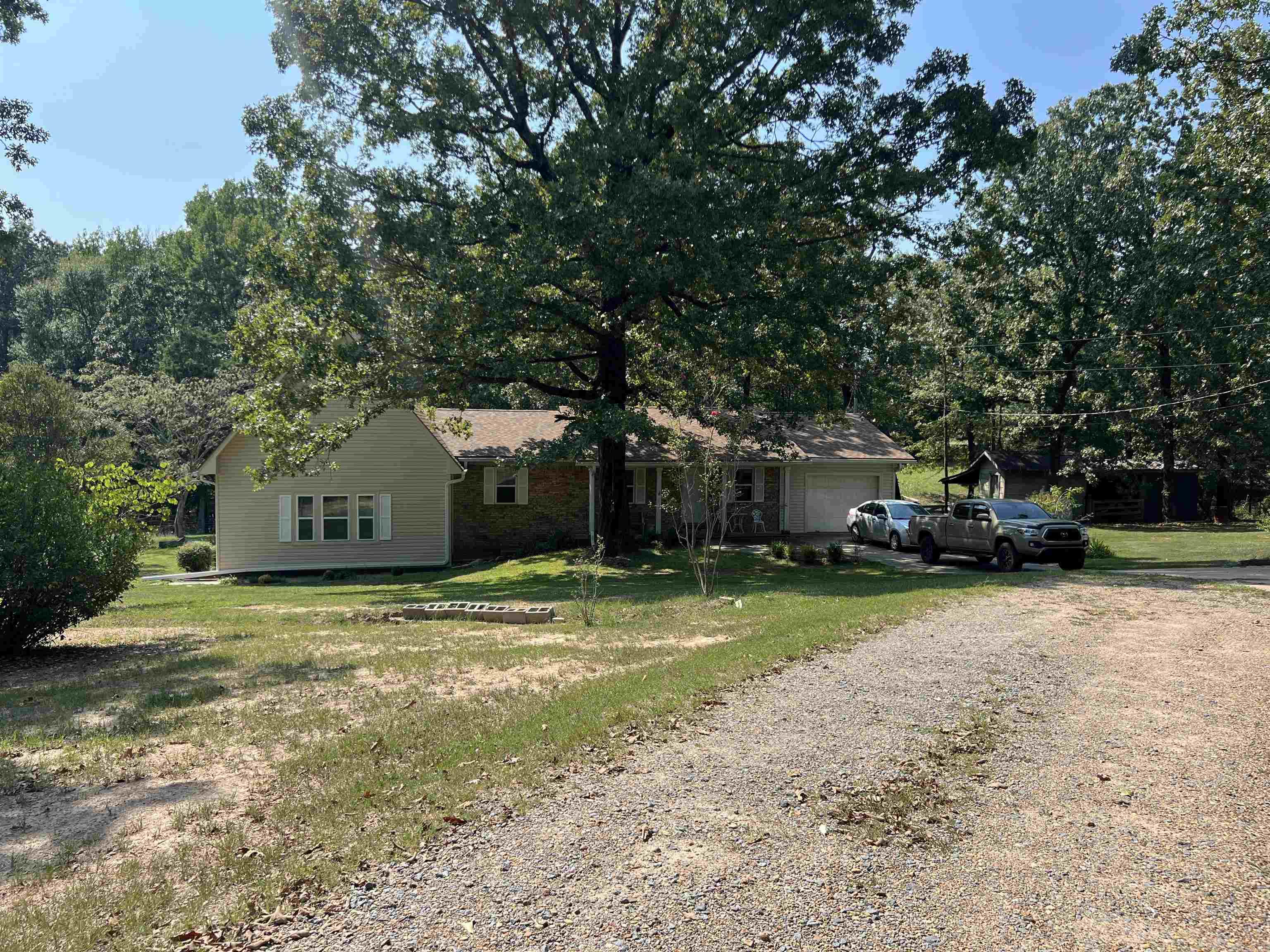 Beautifully transformed 3 bed 2 bath home on 5.73 acres with updates that include new flooring, paint, gutters, hvac air return, windows, doors, water heaters, sheetrock dishwasher and more! This spacious home also has a laundry/utility room and a loft overlooking the den. Outdoors you will find parking for an RV, storage shed, horse barn and a 24x30 shop, a back deck perfect for enjoying your morning coffee or an evening sunset. There is septic, water and electrical hook ups for a mobile home if one was needed to be added on the adjoining pasture. Call today and don't miss the opportunity to see this gorgeous home on acreage.