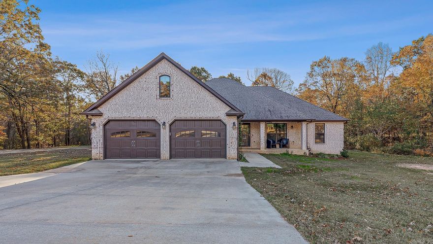 Built in 2018, this beautiful brick home offers 4 bedrooms, 2.5 baths, and a spacious 2,150 sq. ft. of living space on 1.42 wooded acres, providing plenty of privacy and a peaceful setting. The open-concept layout features an inviting kitchen with abundant cabinetry, a large breakfast bar, and stainless steel appliances including a gas range, refrigerator, dishwasher, and microwave hood. A cozy wood-burning stove adds warmth and charm to the living area. Step outside to enjoy the back patio and pool, perfect for relaxing or entertaining during the summer months. With its modern design, thoughtful layout, and private surroundings, this property combines comfort, functionality, and country serenity all in one. Storm shelter in garage floor.