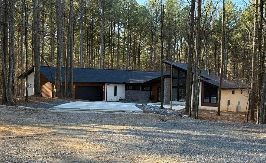 Custom home by Renaissance. This home is a spectacular modern to mid century both inside and outside.  Upgrades galore!  Home built on owners lot.  Builder one year warranty. Taxes lot only.