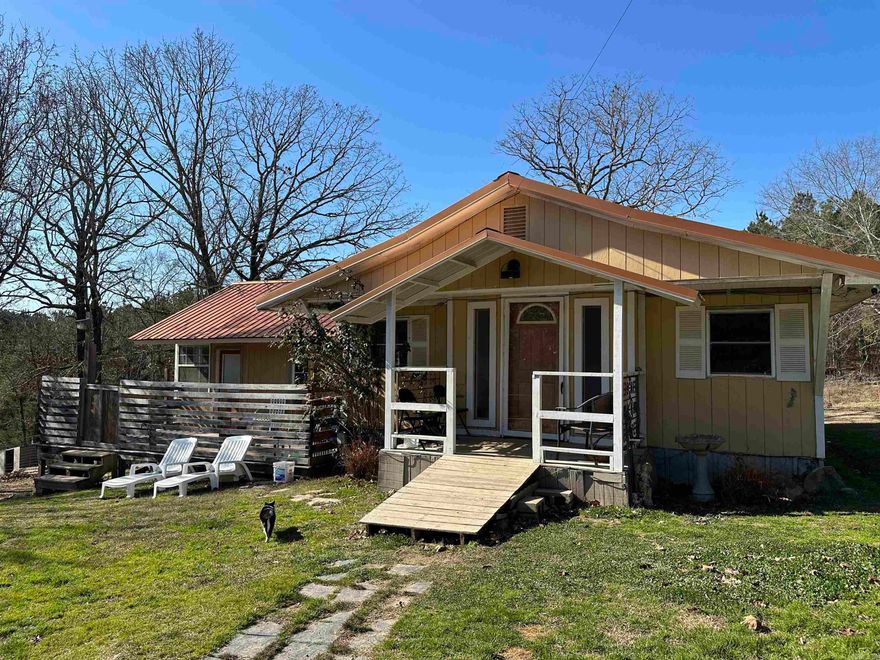 Being sold as a package: 589 Timberlake Drive (Parcel ID: 100-18517-000) & 600 Timberlake Drive (Parcel ID:100-18517-002). Approx. 5 acres in the Lake Hamilton School District with a cozy 3 or 4 bedroom 2 bath one-level country home. Metal roof, central heat/air, and outdoor features including a deck/patio, partially fenced area, dog run, and outside boat or RV storage building—set in a peaceful rural setting. Mobile home without title comes with at no added value.