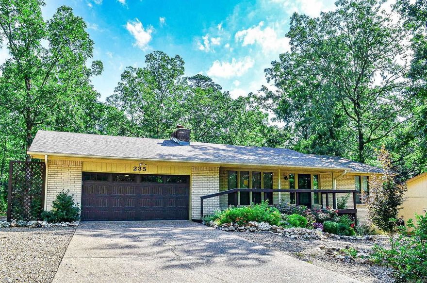 Make this the one. Charming all brick, two bed, two bath home with spacious great room, sloped ceilings, and eat in dining area. Updates include gas logs in great room with remote control.  New front and back decks, lighting, raised ceilings in kitchen with newer appliances, gas stove, new travertine backsplash and laminate countertops. Large laundry with spacious pantries. New tile floor in kitchen and pantry. Refrigerator and washer and dryer to convey. New toilets in bathrooms, countertops, backsplash and tile flooring. New tiled shower. Dual sinks in primary bath. Fresh paint throughout. Enjoy the peaceful setting from your glass enclosed sunroom. Landscaped yard, oversized two car garage with new garage door. Sunroom is not included in square footage. Convenient location close to Coronado Fitness Center, library, and tennis courts. Hot Springs Village has a one time new member fee of $1500.00. Agents Remarks.