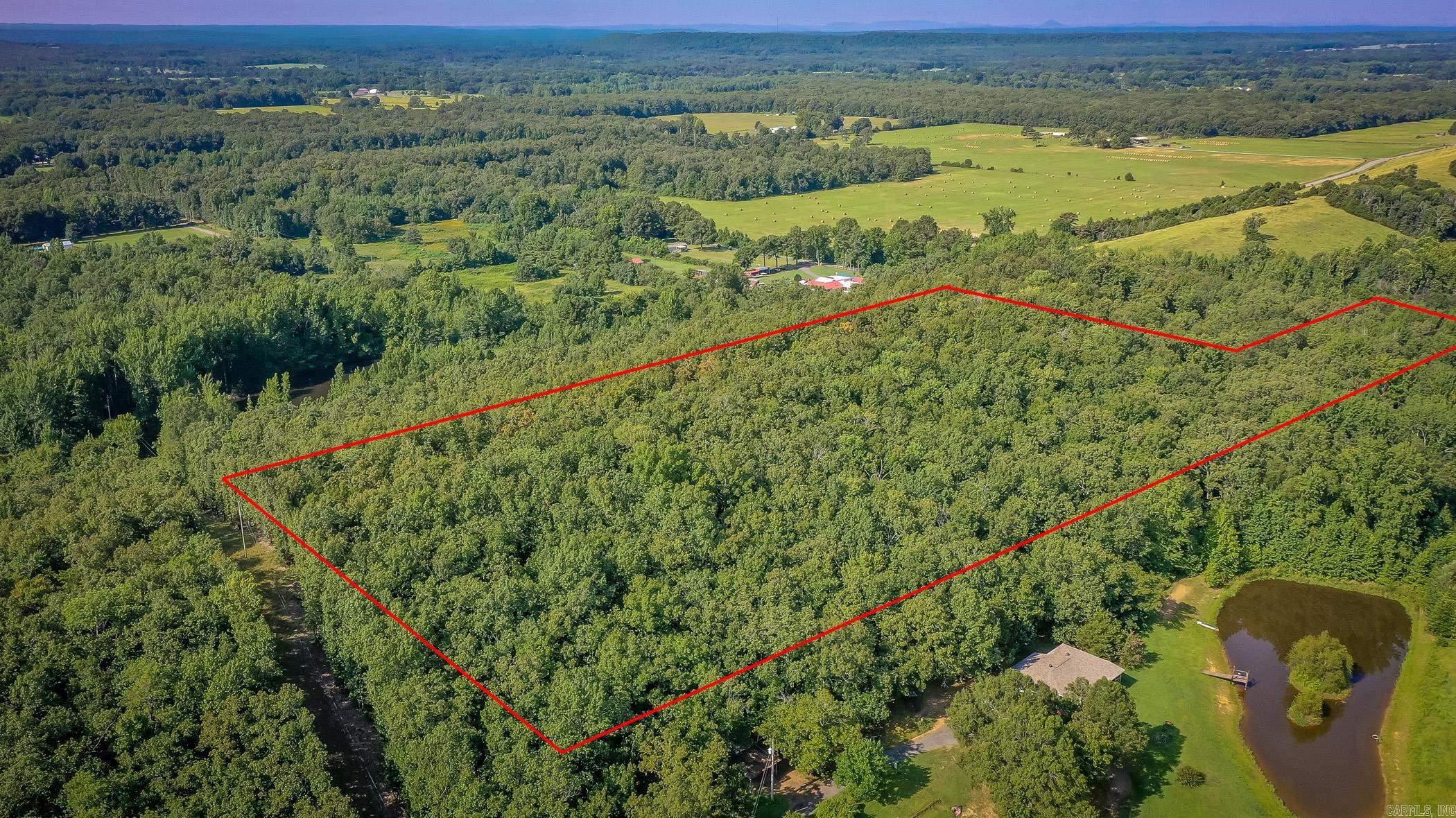 Nice 10.34 Acres of undeveloped land in Jacksonville with lots of hardwoods and wildlife on the property. Enjoy your privacy and build your dreams whether it be a single family residence, private estate, or new development. Electric, water and sewer are available at road. Location: just a few minutes from Little Rock AFB. Acreage is wooded and has fantastic views.