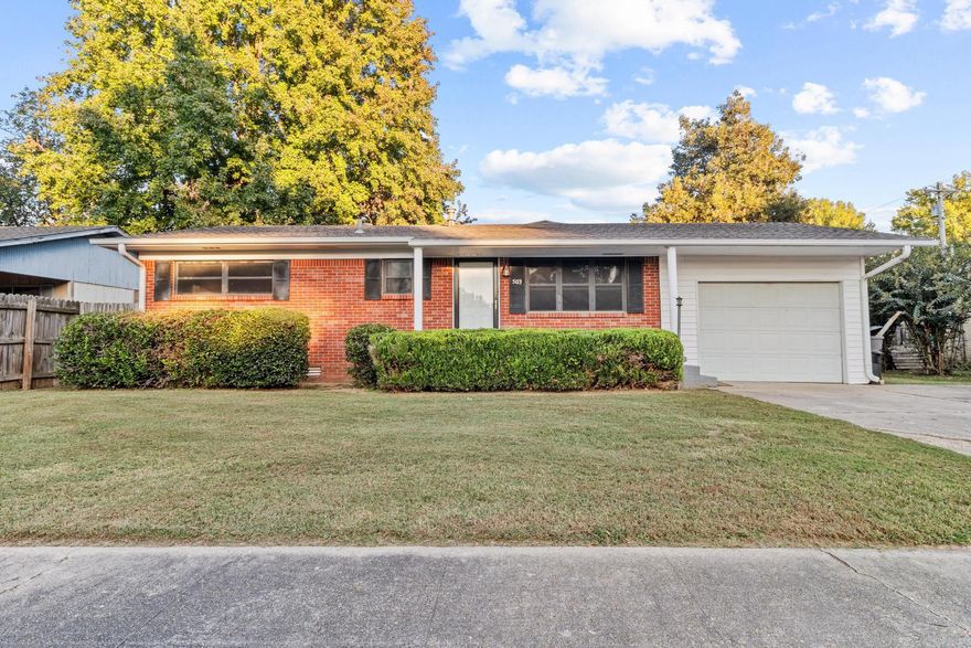 Buyers and investors .... take the time to check out this adorable listing and see what this attractive home has to offer! This 2 bedroom/2 bath home was owned between 30-40 years by the same owner and has been loved and cared for .... it's a gem! This home features an additional living area that was added on in 1990 and a 3/4 bath at some time as well as new roof in 2019 and new windows and a handicap ramp in the 1-car garage that can be removed. Original hardwood floors believed to be in a large part of the house .... updates have continually been made but cosmetic updates would be a plus! Exterior features an additional parking pad .... deck, privacy fenced back yard plus small storage building. This house was rented in the last several years but you would never know it .... it's amazing!  So .... let the curb appeal draw you in and the interior "seal (SELL) the deal"!  Schedule your tour today!!!  * No flood insurance required *