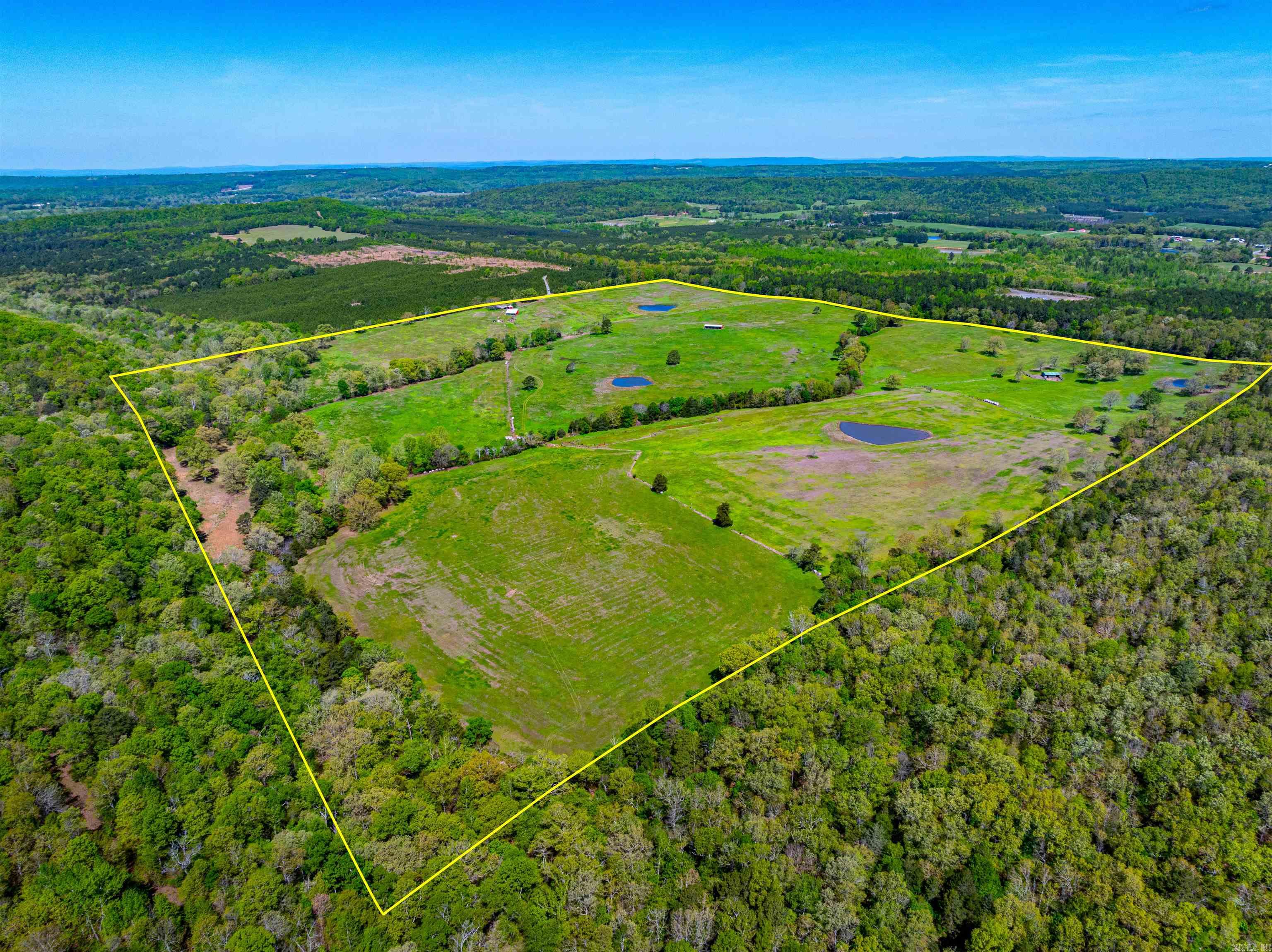 Dreams do come true. Property like the beautiful 160 +/- acres cattle farm rarely comes on the market. This secluded ranch is just about 2.5 miles east of Bee Branch, just off Lankford Circle on a private road nestled among hundreds of acres of tree farms. This farm truly has everything you need. The property features 8 pastures, 4 barns, 4 ponds, 2 holding areas, a spring, and over a half of a mile of beautiful Scroggins Creek that borders the entire south side of the property with a rock face that serves as a great backdrop to take pictures. Deer and Turkey are abundant. The bonus is this property is only 12 miles from beautiful Greers Ferry Lake Sugar Loaf boat access. MINERAL RIGHTS do not convey.