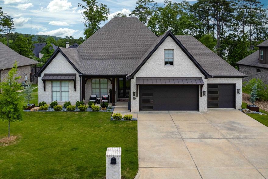 Welcome to this stunning home featuring an inviting entry with tall ceilings, beautiful neutral paint, and gorgeous wood floors, all framed by elegant iron and glass front doors. Natural light floods the open, split floor plan, which includes two guest bedrooms and a bath separate from the luxurious primary suite. The spa like primary bath offers a perfect retreat, and the spacious walk-in closet provides direct access to the laundry/mudroom for ultimate convenience. A dedicated office, currently as a gym, adds flexibility. The fantastic kitchen features a massive center island, double ovens, a spacious pantry, and ample storage, all flowing into the dining area and inviting living room with a cozy gas fireplace. Upstairs, you’ll find two versatile bedrooms/bonus rooms with attic access, abundant storage, and a full bath. An extra large three car garage offers plenty of space for vehicles and storage. Step outside to the covered back porch with remote screens and heater, perfect for year round enjoyment, overlooking a beautifully landscaped, fully fenced backyard. This exceptional home combines elegance, functionality, and comfort. Come See!