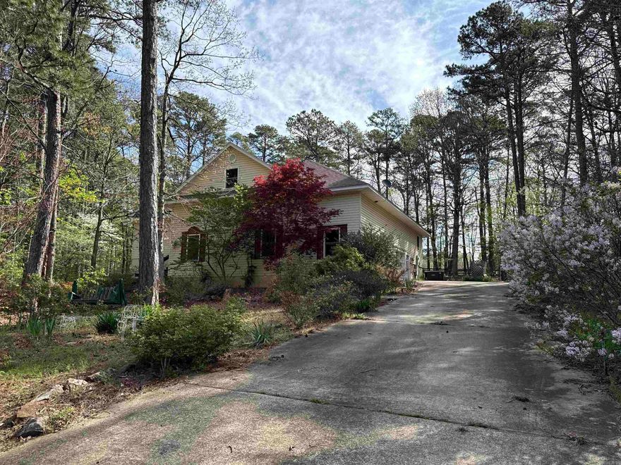 CUSTOM GOLF COURSE HOME on 2 replatted lots, on Indian Hills Golf course  #15.  The 1900 sq. ft. open floor plan is spacious with Pella windows to give natural light, & a view of the golf course!  Large open kitchen has slate countertops, Alder wood cabinets, dbl. wall ovens, surface range, & LOTS of storage!!!  Relax in the living area by the woodburning fireplace on chilly days.  The Master suite with large bathroom, plus Guest room is apart, with Bath #2.  The 2-car garage also has a golf cart garage, AND a shop that is heated & Cooled.  This space could easily function as a hobby room, office, workout area!  Go upstairs to a floored attic for more storage, or convert it to more living space.  Very energy efficient, plus there's back-up generator, just in case there is a power outage!  You'll enjoy the large rear deck for viewing golfers & relaxing.  The yard is beautifully landscaped with a water feature, flowering shrubs & trees (lenten rose, azaleas, lilacs, dogwoods, wisteria, apple trees, and more!!).  The walk-in crawlspace gives easy access to plumbing, electric lines, ductwork, waterheater.  This property has it all!!  You can use of all Fairfield Bay Resort amenities!