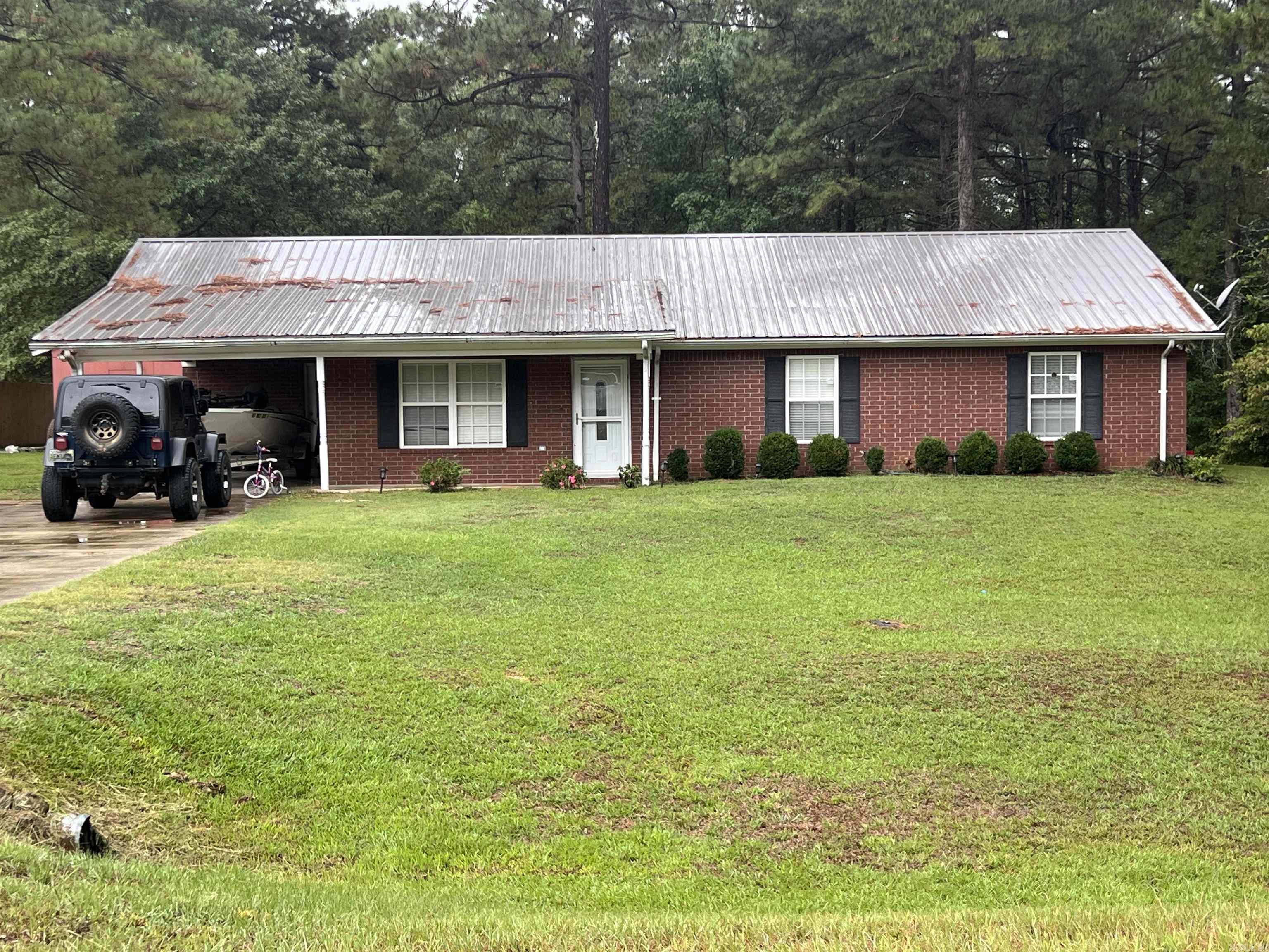This charming three-bedroom, two-bath home sits on almost an acre lot and offers plenty of space inside and out. The large, fenced-in backyard provides a perfect setting for pets, play, or entertaining. Inside, you’ll find a spacious kitchen featuring abundant cabinets, a center island, and a cozy breakfast area—ideal for casual meals or morning coffee. The home also includes a separate laundry room for added convenience. The master suite is generously sized, offering a comfortable retreat, while the two guest bedrooms are spacious and inviting. With its thoughtful layout and beautiful lot, this home has all the space and comfort you’ve been looking for.
