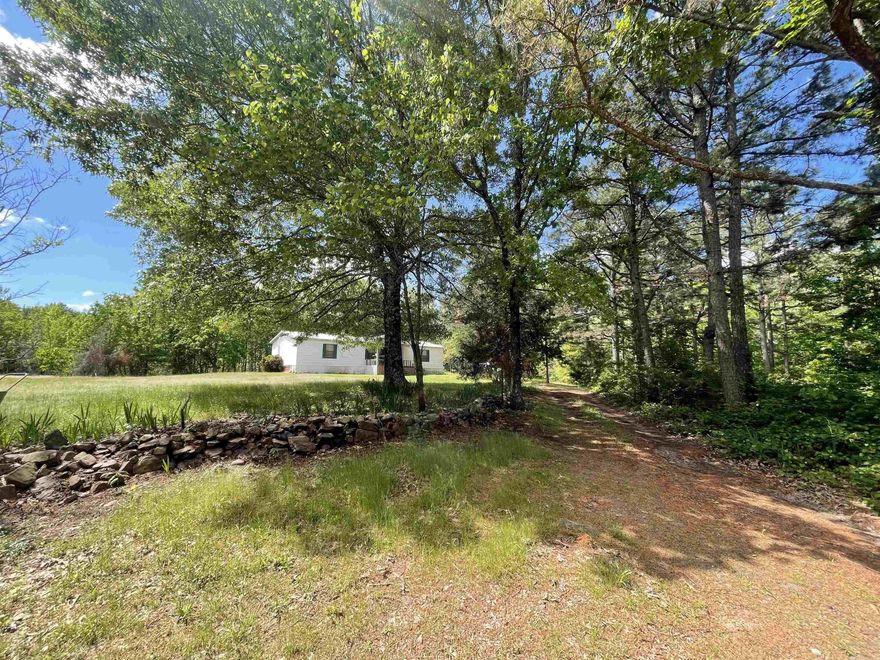 If you're looking for serenity you have found it! This amazing 20-acre estate features a 3 bedroom 2 bath home with a woodburning fireplace, huge pond, cozy pavilion to host cookouts, 1 bedroom 1 bath cabin, storage shed, shop with covered carport and borders National Forest on the eastern side. Conveniently located five minutes from Mill Creek and Fourche Mountain ATV Trails, one hour from Hot Springs and Fort Smith and approximately 30 minutes from Mena's amenities. This is a nature lovers paradise!