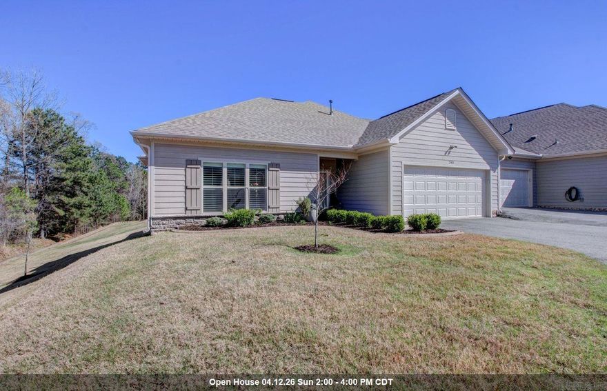 Enjoy life more in this one-of-a-kind home within the quiet, comfortable Mountain Terrace Estates community.  The single level townhome rests on a double lot overlooking a green space.  This unique floor plan is larger than any other in community and it shows in the living room, office/sitting room, and kitchen.  Plantation shutters, undercounter lighting, concrete edging in yard, two bedrooms, very private fully covered porch.  An expensive framed TV will remain with the home.  The larger kitchen has extra counter and cabinet space, includes undercounter lighting and a five-burner gas stove require fun in the kitchen.  Primary ensuite includes oversized shower with functional bench, double vanity, window, and walk in closet.  Slab granite counters throughout and custom tile, rich wood floors with plush carpet in the bedrooms.  This is a beautiful example of a fine home for the buyer with discerning tastes.  Level driveway, and entry to house from front door and garage, no steps.  Lot slopes away from house but access to home is very level and safe.  HOA takes care of lawn care and exterior maintenance, ask listing agent for more details.  Ring door bell does not convey.