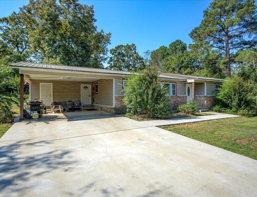 MOTIVATED SELLER - ALL OFFERS WILL BE CONSIDERED.  Fixer-Upper. Sold as-is.   Lake Hamilton School District.  Explore this charming 3-bedroom, 2-bathroom ranch-style home on half an acre! Great neighborhood near Lake Hamilton School.   Partially updated but in need of additional repairs due to a roof leak. Roof has since been replaced. Granite countertops, stainless steel appliances, renovated bathrooms, a new metal roof. Upgraded wiring and plumbing. Spacious laundry room.   There is plenty of room for children, pets, gardening and separation!  Fenced Back yard with room to roam.   Assumable 3.25% interest rate opportunity buyer needs to be a VA using certificate.   Agents - please schedule showings with Showing Service.