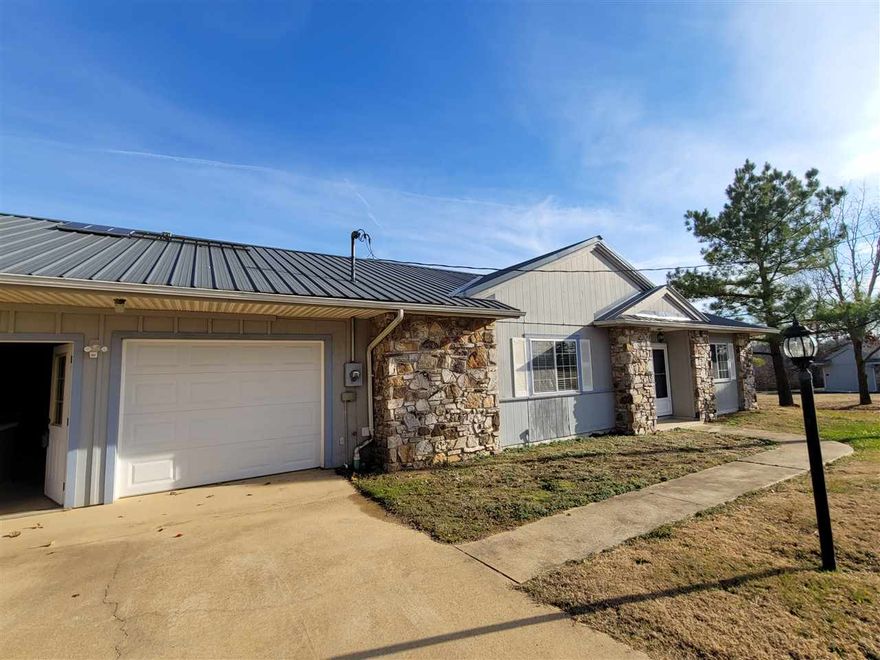 All electric duplex (attached at garage) Bonus room-Office/third bedroom open to LR. Stove, Fridge & Dishwasher included. Heat/cooled double garage w/storage. Metal roof!! Sits on a dead-end road, about 1 mile of gravel. Master bedroom has 2 closets & a private 3/4 bath. No carpet--tile in baths/kitchen/dining, vinyl flooring in bedroom & living room. Wood-burning stove for backup heat. Each adult is required to complete an application for a credit/criminal background check. $39 added to rent for pest control, liability insurance & credit reporting services. Rent does not include utilities. Tenant is responsible for trash pickup and lawn care.