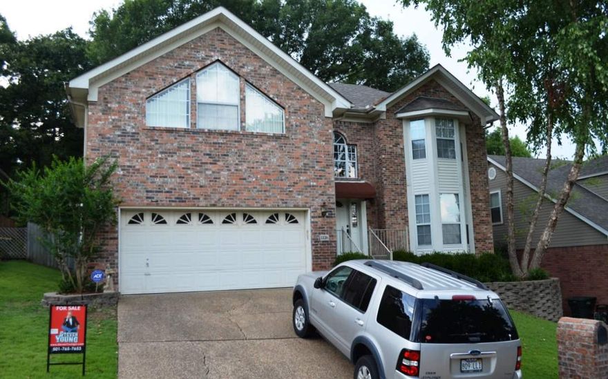 Secluded location, right in the heart of West Little Rock! Two story Foyer features hardwood entry/w vaulted ceilings in adjoining great room. Spacious great room features gas fireplace/w brick hearth, custom mantle & extensive wood moldings. The large open dining area is perfect for entertaining! The eat-in kitchen features Maple finished cabinetry & sun-lit bay window dining. The large Master Bdr. features a 5 piece bath. Entertain family on over-sized deck/w gorgeous fully fenced park-like backyard!