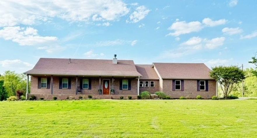 Country home with acreage in Jonesboro, Arkansas on 7.23 acres—ideal horse property just minutes from town. This 4 bedroom, 3 bath home offers just under 3,000 sq ft under roof with a main level plus a full finished walkout basement.   The main level offers 3 bedrooms, 2 baths, plus an open floor plan that connects the living, dining, and kitchen areas. The kitchen is newly remodeled with updated cabinetry, granite countertops, and stainless steel appliances. A pantry and storage room off the kitchen provide washer and dryer hookups.  The basement features its own private living space with a large den with fireplace, plus a huge bedroom and bathroom suite. Additional amenities include a long covered front porch, back sundeck, a 2-car attached garage.  This country home with acreage on 7.23 acres is a great equestrian property. Features a 30x30 3 stall horse barn, holding pen & a small arena for barrel racing or roping practice. A huge catfish pond is also included!  Located on the edge of Jonesboro city limits, just minutes from Arkansas State University, NEA Baptist Hospital & St Bernard's Regional Medical Center, this property offers country living with convenience.