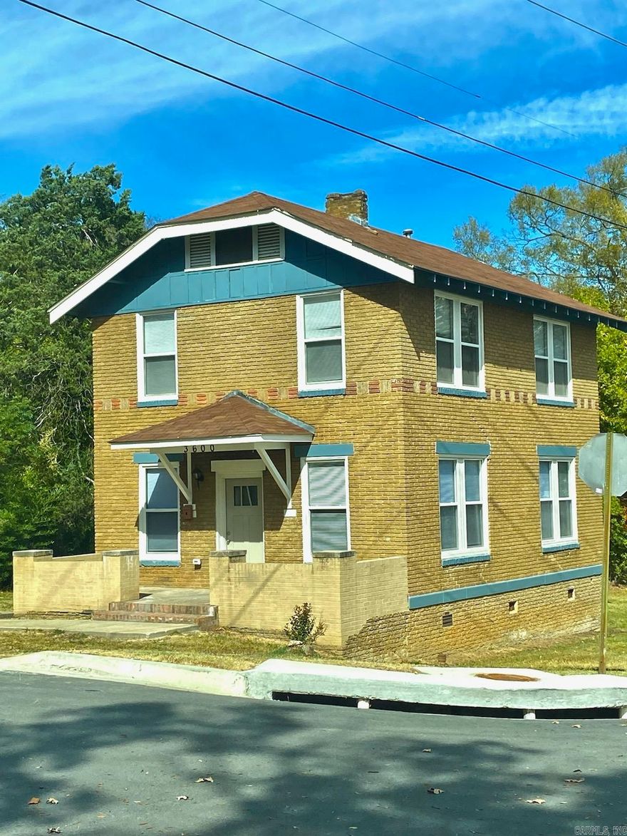 Brick two stories!! One bedroom down and two bedrooms up. No carpet!!! The kitchen has a dishwasher, disposal, lots of cabinet space, and refrigerator stays!!  Laundry room off kitchen.  Living and dining room plus half bath down.  Full bath up.  Wood floors and tile in wet areas.  Nice sized back yard and two car driveway.