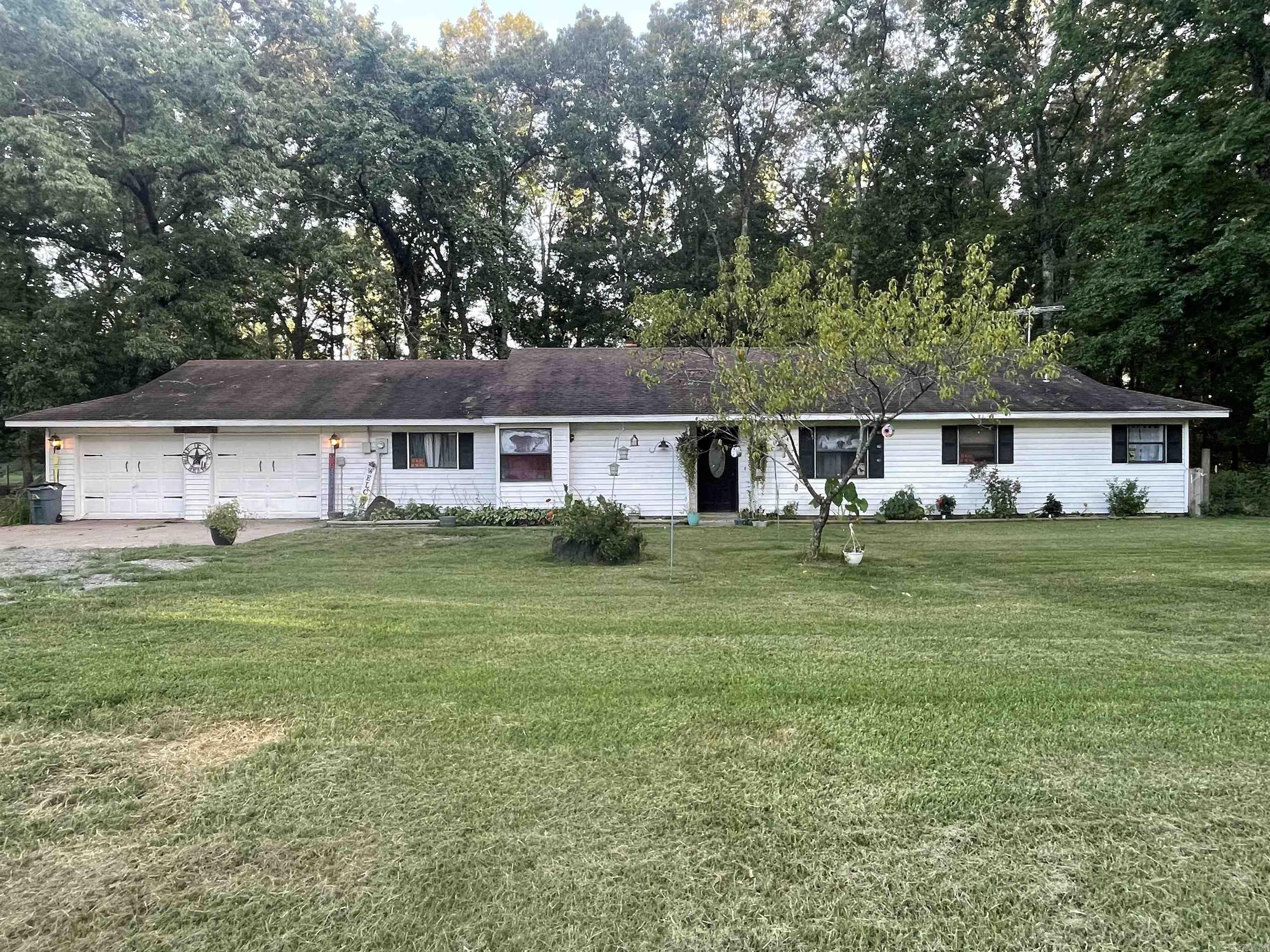 Spacious home on approximately 3.16 acres. Open Living area, large bedrooms, spacious laundry room, and screened in back patio. The office/flex space could also be a 4th bedroom with private bath. Kitchen features new backsplash against freshly painted cabinetry. New paint & new vanity in master bath. Back patio cover extended in 2024, 20x20 shop with electricity, RV hookup on property. USDA/RD eligible.