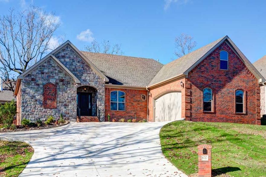 Classic brick home with stone detail. 3 bedrooms with 2.5 baths. Nice open floor plan features wood floors throughout the main, carpeting in the bedrooms, & tile in bathrooms. The great room features a fireplace & overlooks covered porch. Gourmet kitchen is decked out w/stainless appliances, granite, large pantry, gas range, & built in spice racks. Master bath features walk in shower, 2 vanities, & 2 walk in closets. Laundry room access from the master. Keypad entry to garage, parking pad, & partial fence.